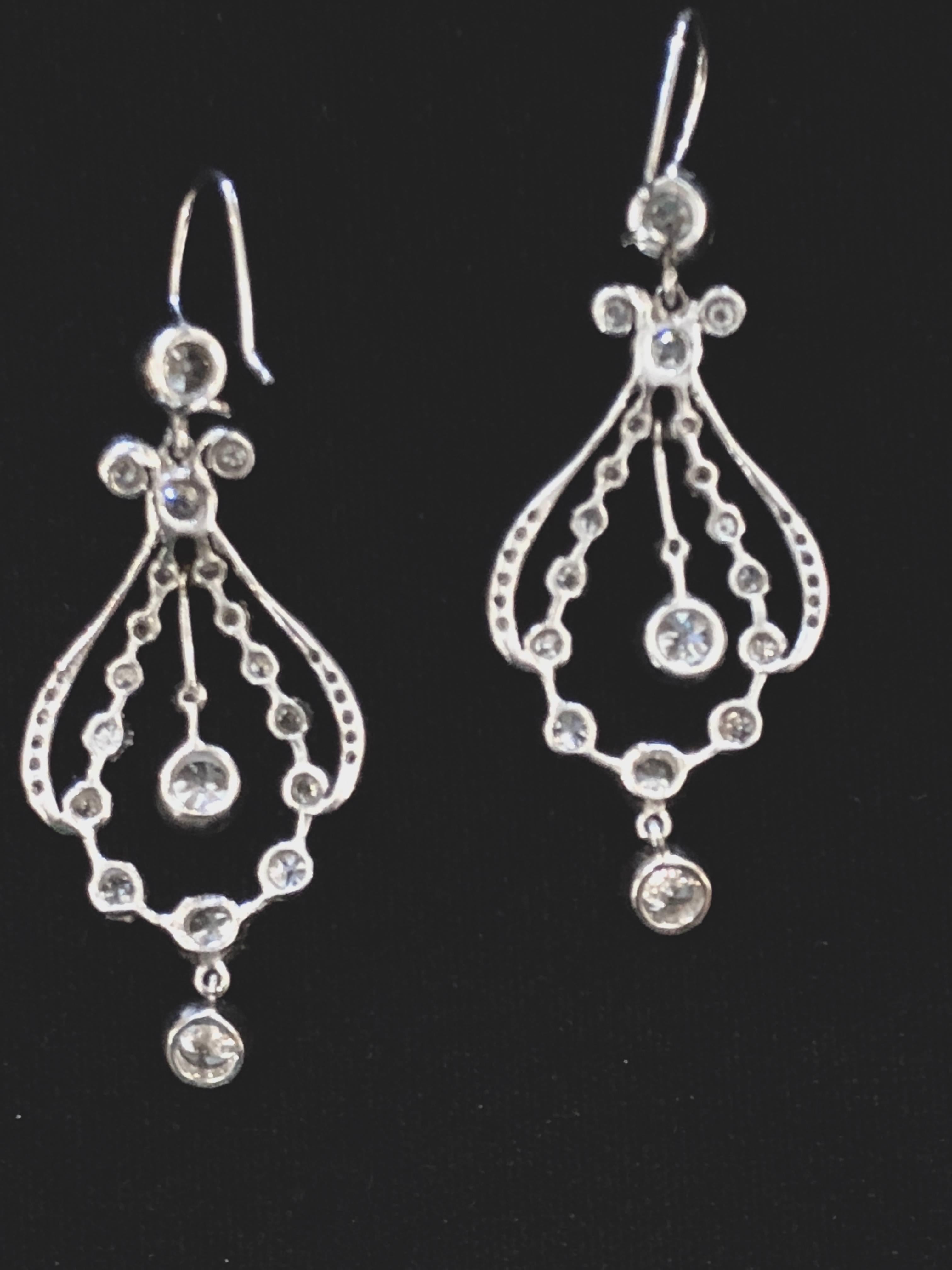 Diamond and platinum chandelier earrings with approximately 7.30cts of diamonds total.
There are approximately 3.65cts of diamonds per earring. The diamonds are full cut, have G-H color and VS1-SI1 clarity. The earrings are period Art Deco circa.