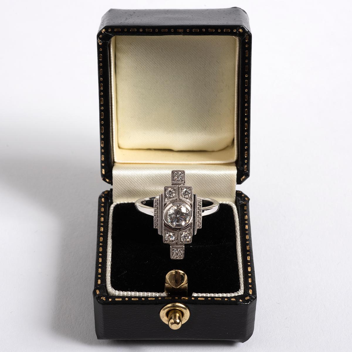 A unique piece within our carefully curated Vintage & Prestige fine jewellery collection, we are delighted to present the following:

Our art deco inspired diamond cluster ring has an 18k white gold setting and features a central round old cut