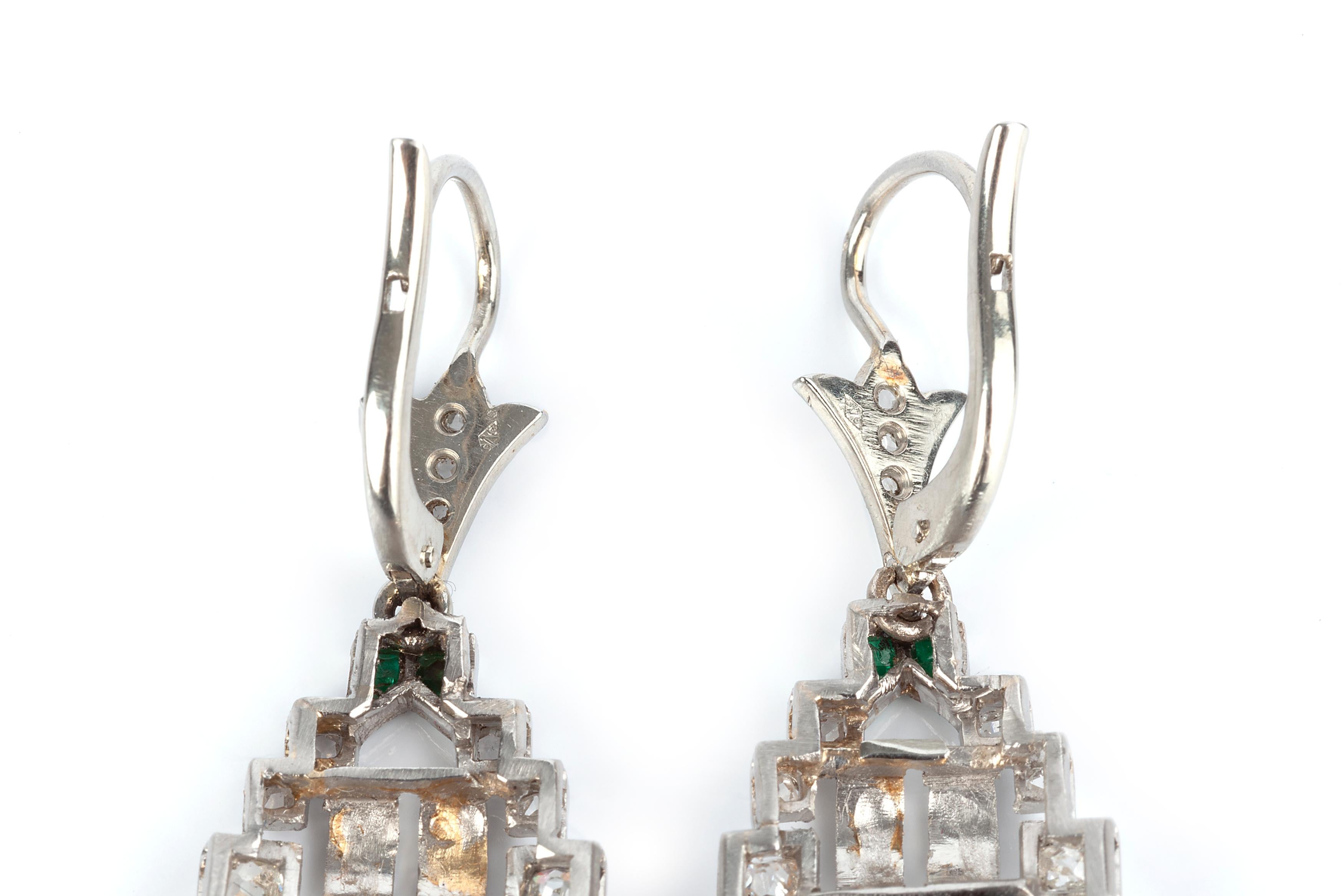 A pair of art deco diamond emerald and natural coral earrings set in 18 karat gold with a french hallmark. They earrings are original art deco and set with rose cut diamonds and baguette emeralds.  4.4cms x 1.6cms.