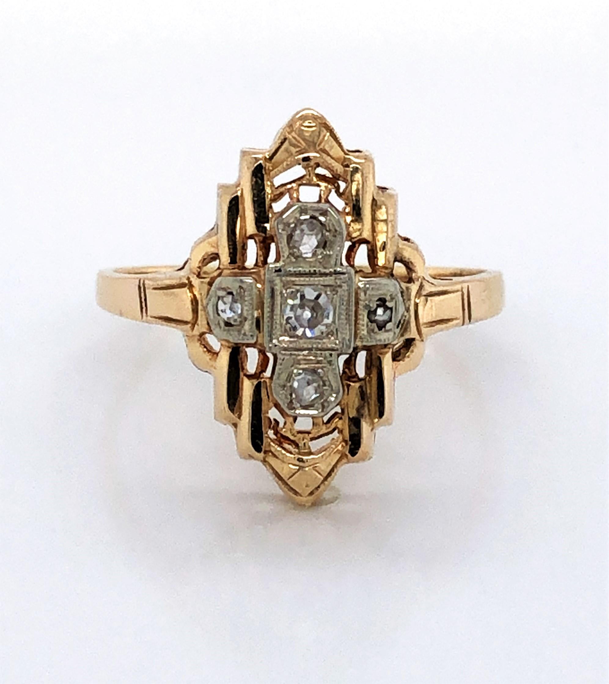 The regal geometric design of this lovely antique ring created in fourteen karat 14k yellow gold depicts the elegance of Art Deco style. Featuring a four-stone center in a cross formation with one .10 carat miner's cut center stone flanked by four