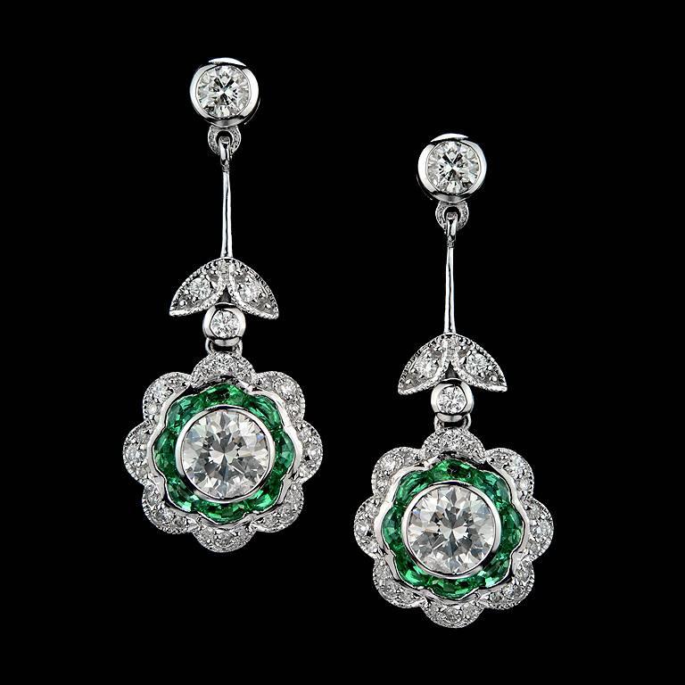Earrings set with 2 pieces Total 1.11 Carat weight Diamond and French Cut Natural Emerald from Zambia 16 pieces 1.50 Carat. set with 56 pieces 0.58 Carat weight Diamond

The Earrings was made in 18k White Gold.