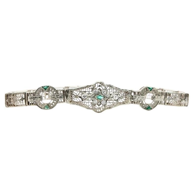 Bracelet filigrane Art déco en or blanc 14 carats avec diamants et émeraudes