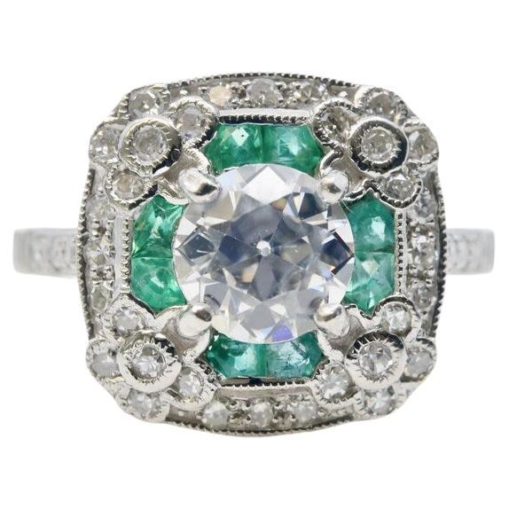 Verlobungsring aus Platin mit Diamanten und Smaragden mit Blumenmotiv im Art déco-Stil