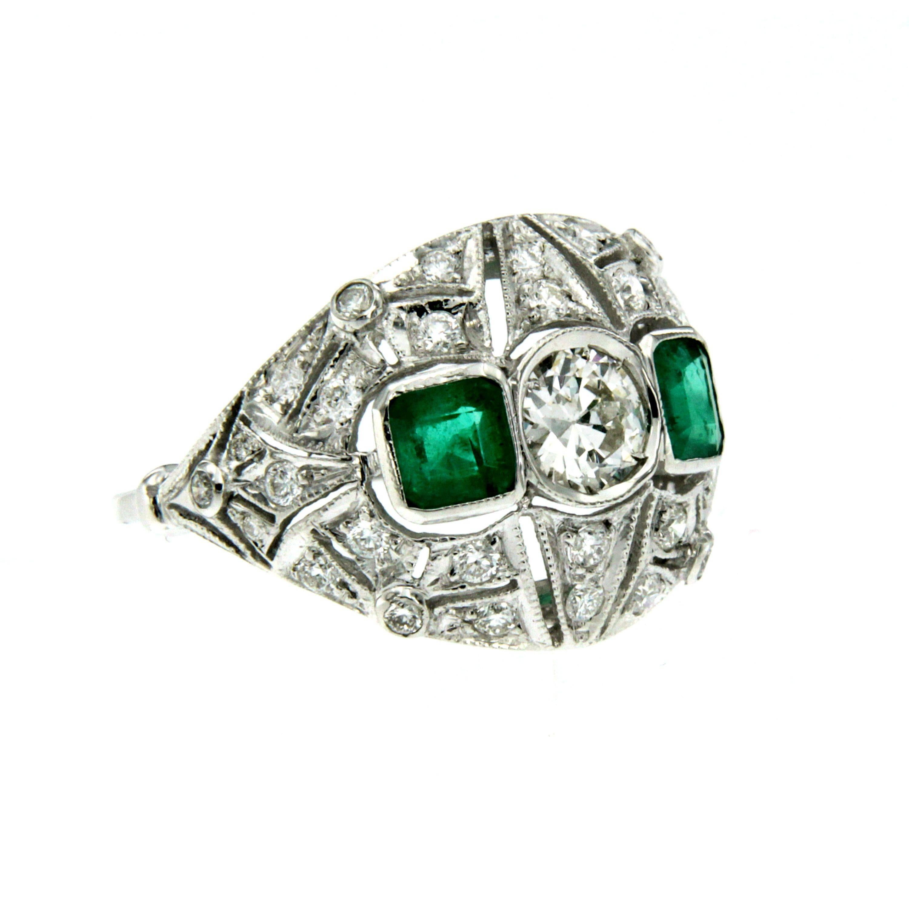 Stunning Art Deco gold ring set in the center with approx. 0.50 ct old mine cut diamond surronded by approx. 0.38 cts of old mine cut diamonds and approx. 0.72 ct of colombian emeralds.
Circa 1930

CONDITION: Pre-owned - Excellent
METAL: 18k