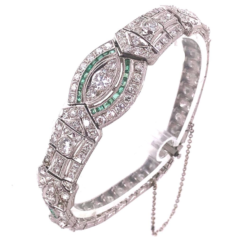 Stunning Original Art Deco diamond and emerald bracelet. The bracelet is hand crafted in platinum and features 5.00 carat total weight of Old European Cut Diamonds and 28 accent emeralds. The diamonds are all graded G-H color and VS-SI1 clarity. The