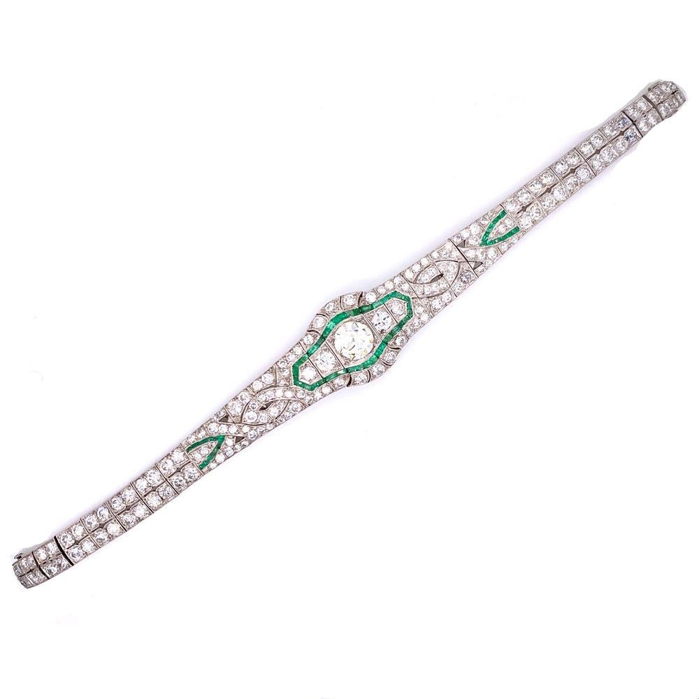 Gorgeous Art Deco Diamond Emerald Platinum Bracelet. This original Deco bracelet features a center 1.65 carat Old European Cut diamond graded K color and VS2 clarity. Another 8.50 carat of Old European cut diamonds are set with emerald accents in