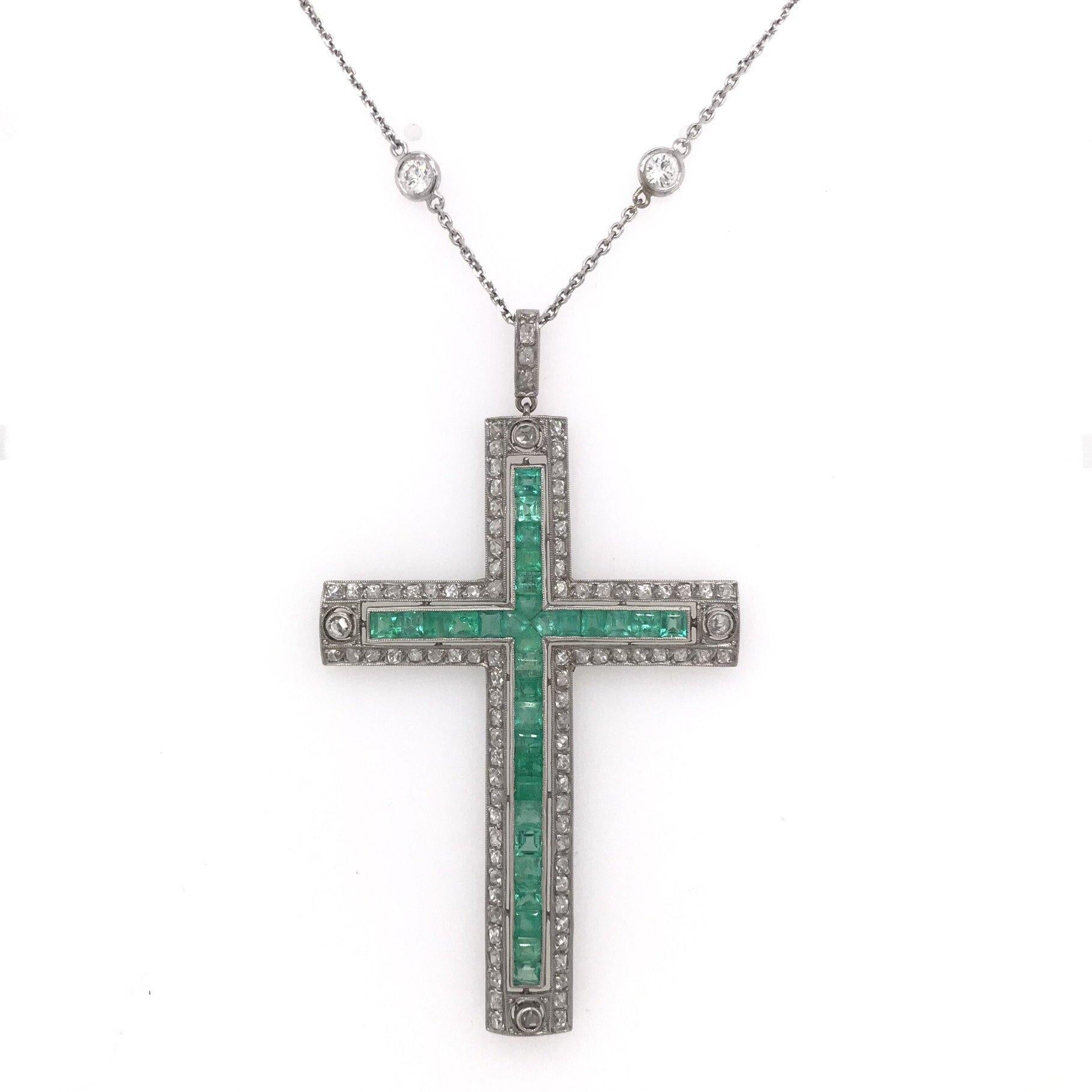 This cross pendant is an antique piece, handcrafted sometime during the Art Deco design period ( 1920-1940 ). This incredibly decadent antique cross features 1 carat of old mine cut diamonds and 2.50 carats of vibrant emeralds. This diamond and