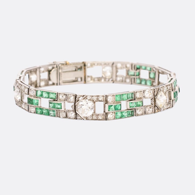 An ultra cool Art Deco 8.6ct diamond and emerald panel bracelet dating from the 1930s. It's beautifully made, crafted in platinum throughout with the finest of millegrain detailing to the settings. The principal stones are old cut diamonds - a mix