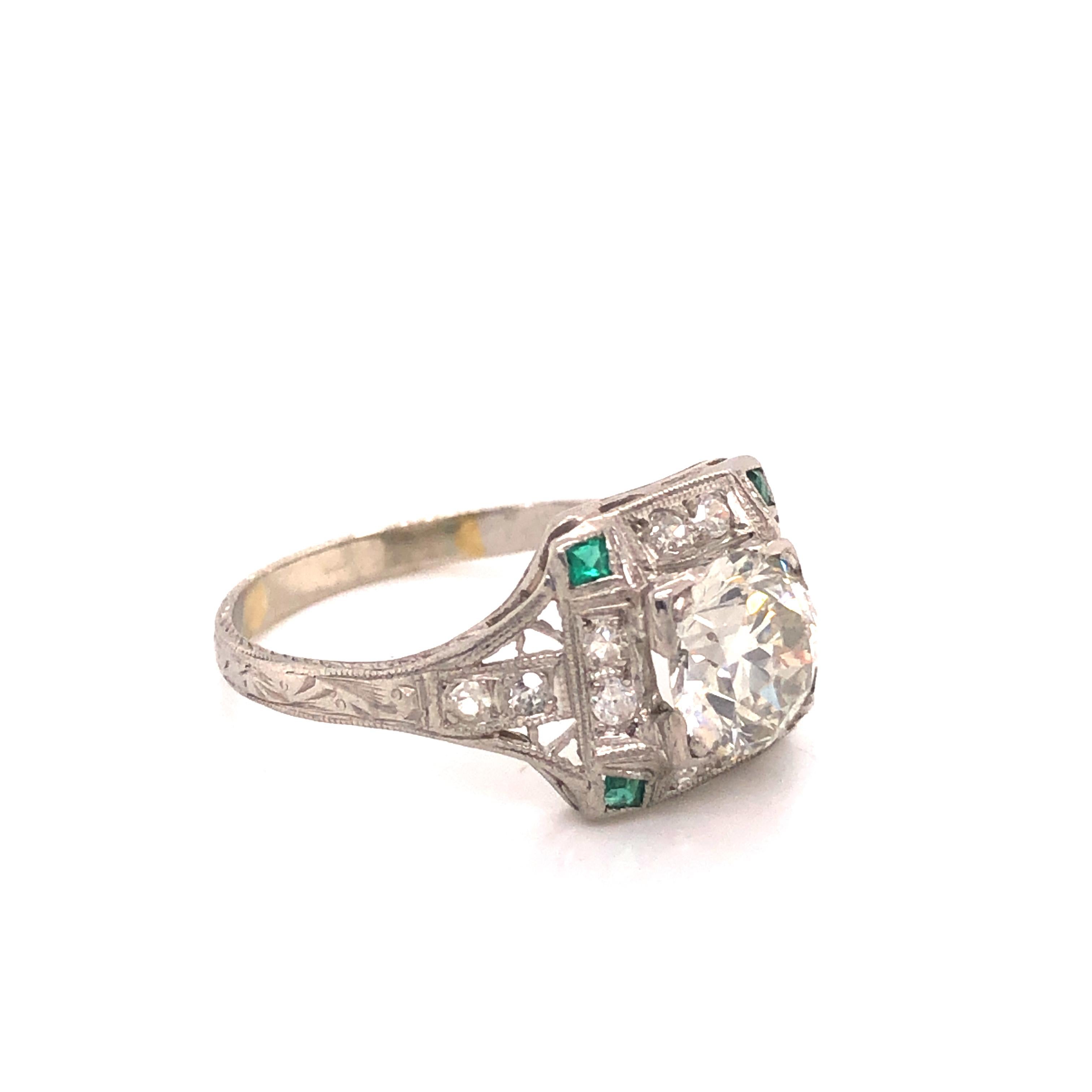 Gorgeous ring from the Art Deco time period. This ring has details throughout as it truly is as beautiful as the day it was created. The ring is highlighted with one earth mined natural round diamond with an old mine cut. The center diamond is the