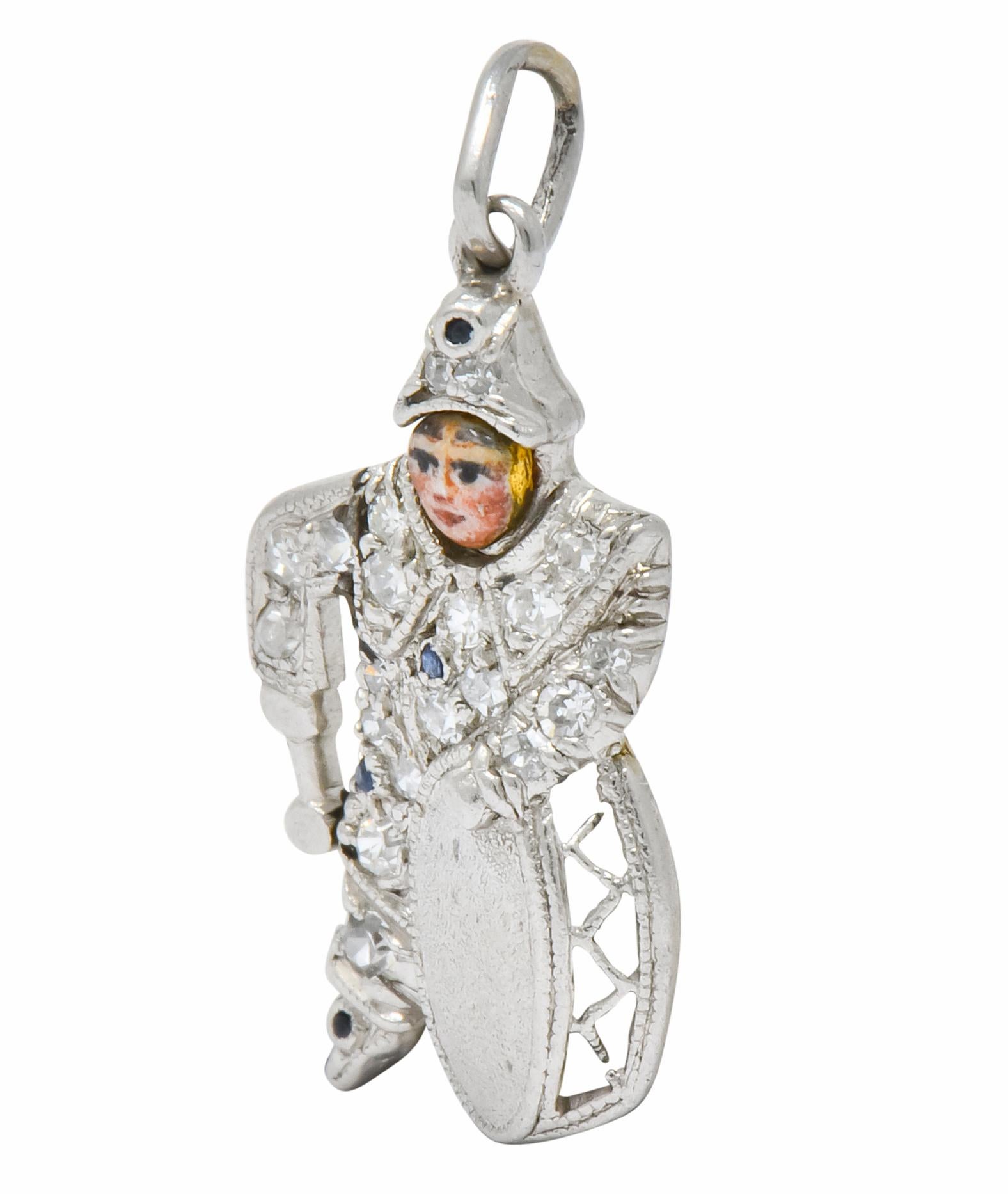 Designed as a little drummer boy with a highly detailed enamel face

Set throughout by rose cut diamonds and blue sapphire accents

With millegrain detail

Tested as platinum

Measures: Approx. 3/4 x 1/3 Inch

Total Weight: 1.2 Grams

Fun. Amusing.
