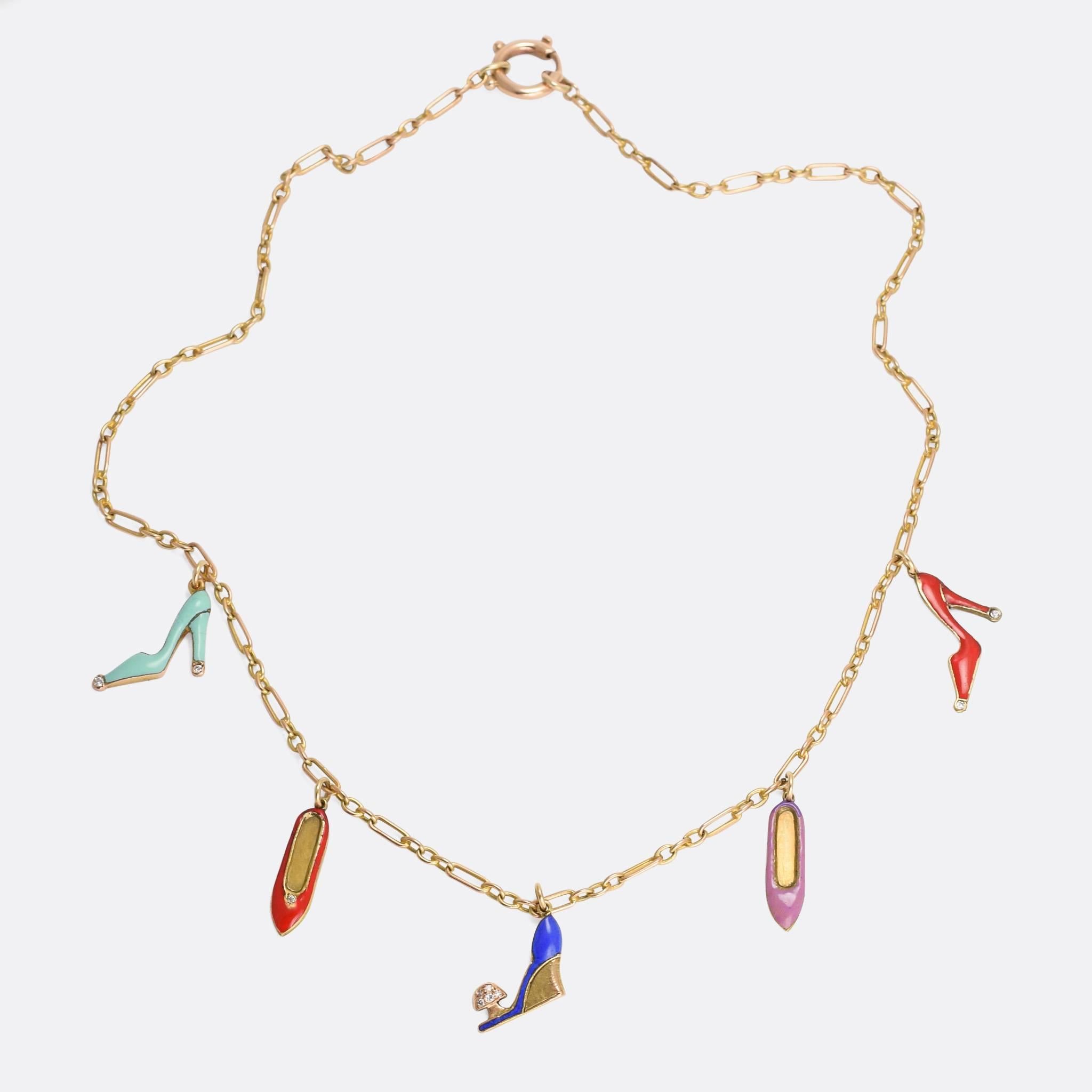 An especially cool Art Deco necklace; five shoes dangle from the oval link chain. Each one has been colourfully enamelled, and they're set with white diamonds. Two flats, and three high heels. It dates from the 1920s, modelled in 9k gold