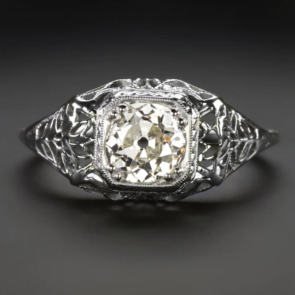 Introducing an exquisite piece of history, our Art Deco Diamond Engagement Ring embodies the elegance and sophistication of a bygone era. 
This captivating ring showcases a mesmerizing 0.86ct old European cut diamond, evoking the allure of vintage