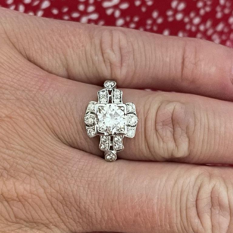 Art Deco diamond  engagement Ring with 1.04 carat center diamond. This beautiful ring is crafted in 18k white gold and features gorgeous details and design elements. The center diamond is set in 4 corner prongs. The diamond is I in color and VS2 in