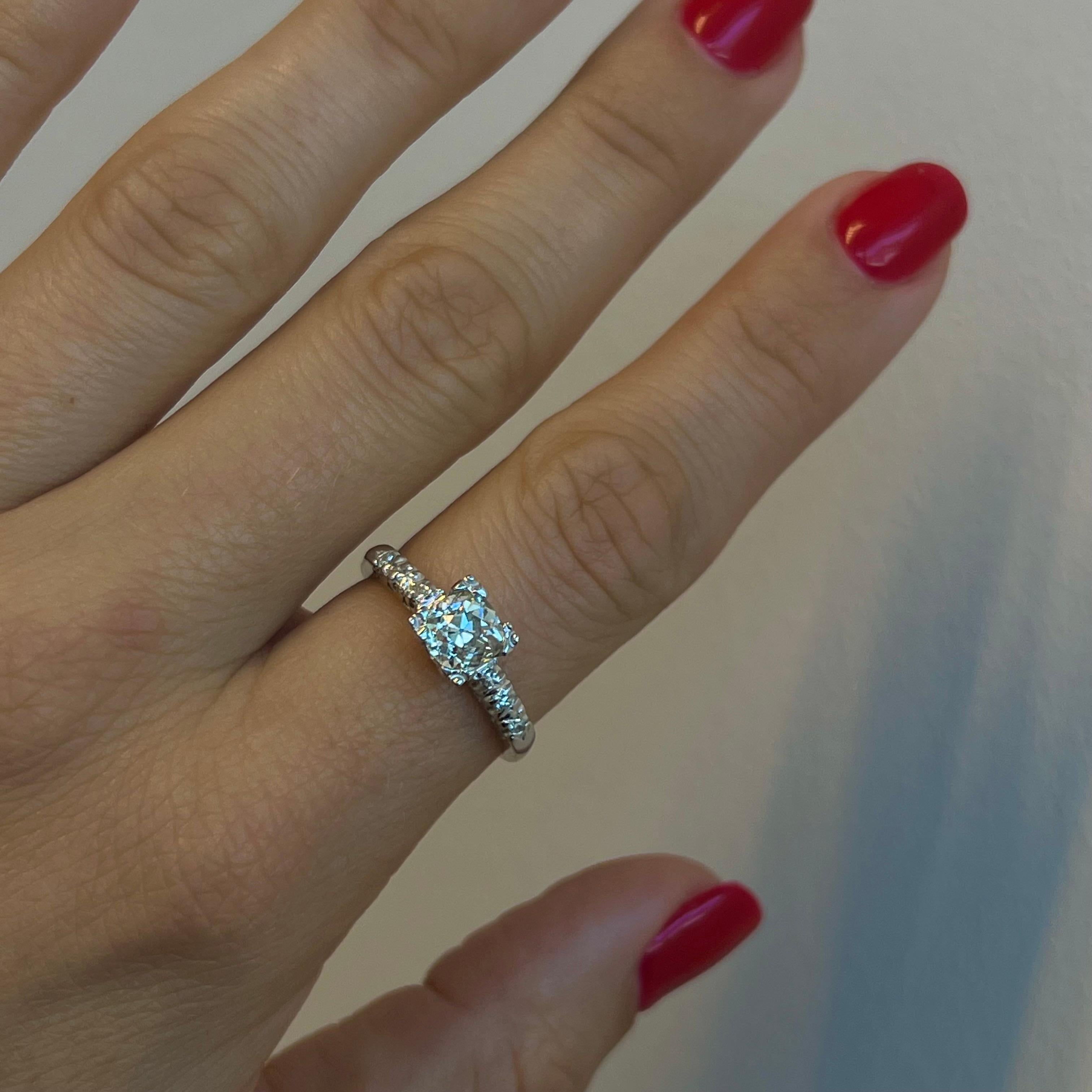 Behold the beauty of a truly authentic Art Deco engagement ring in 14k gold, crafted with unmatched attention to detail and sophistication that will take your breath away. This ring features a stunning natural earth mined old European cut diamond at