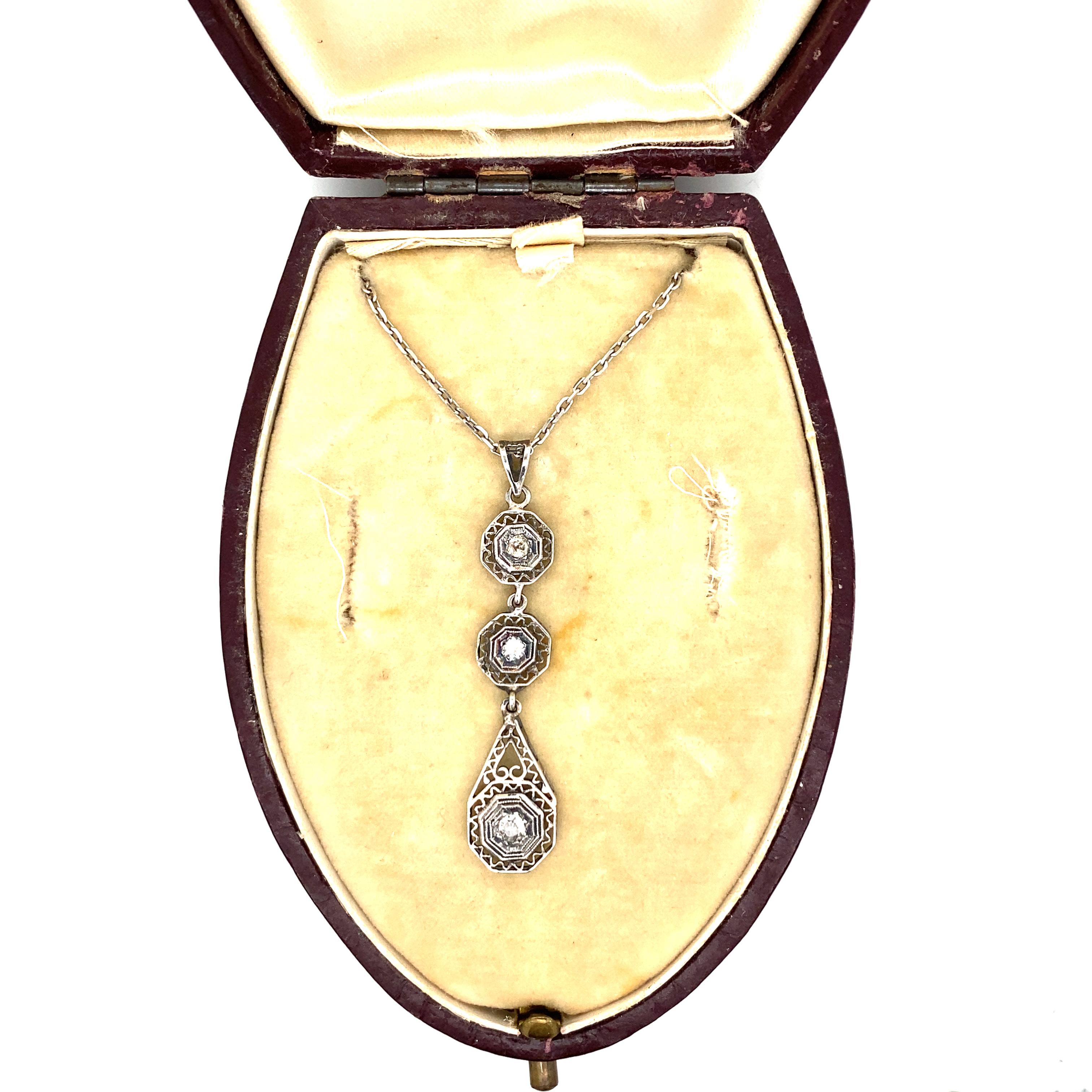 Genuine antique 1930's Art Deco 18k white gold necklace set with old mine cut Diamonds for a total weight of ,20 Carats I color, Vs2 clarity. 
This jewel is authentic in every part, the engraving and filigree make it unique. Comes with original