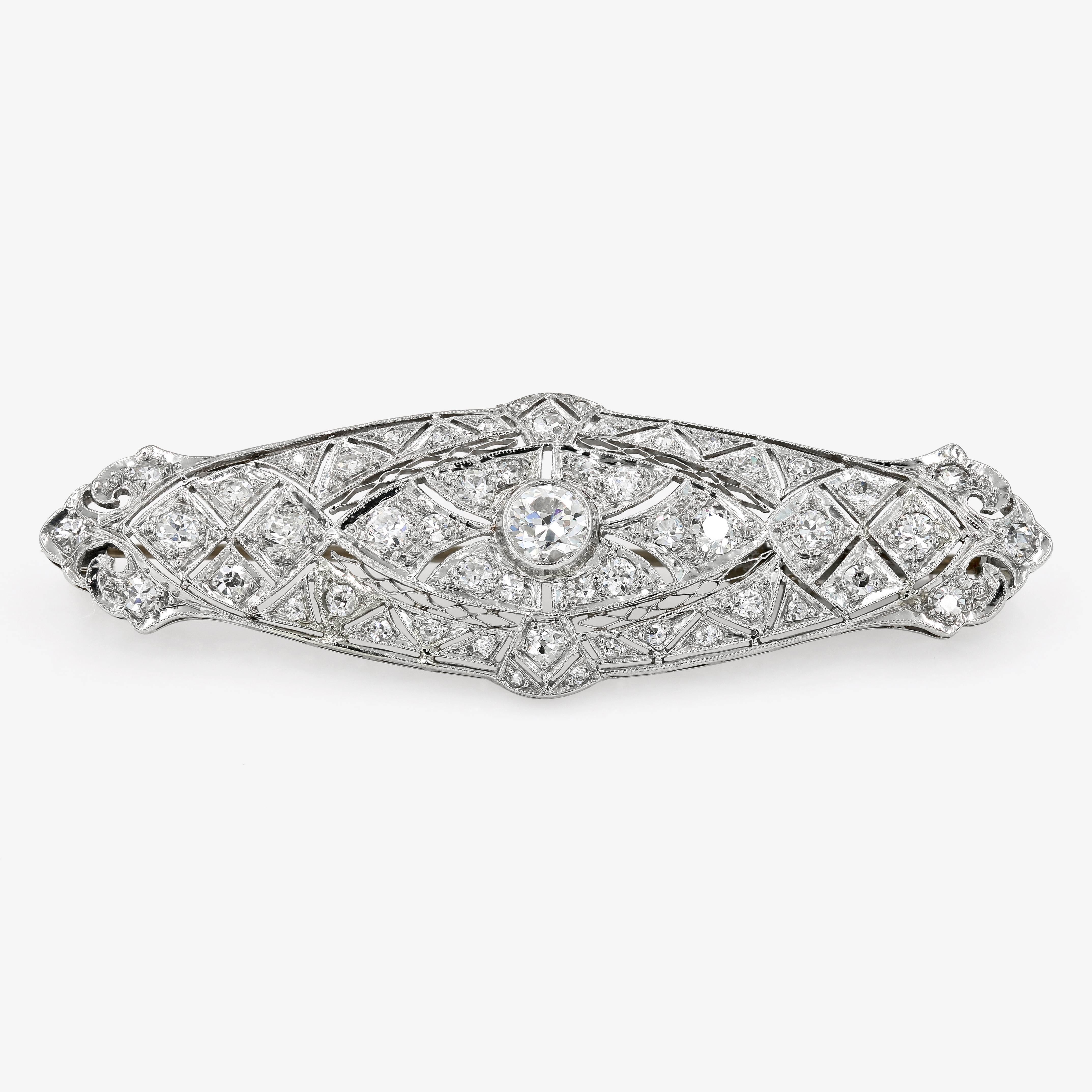 This unique Art Deco estate pin in platinum is set with one round center diamond= .33ct. and  50 round diamonds=.77ct. t.w. for a total diamond weight of 1.10cts. t.w. The diamonds are H in color and range from SI1-VS2 in clarity.

Every Lester