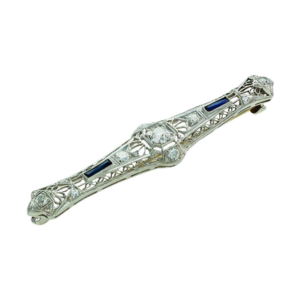 Art Deco diamond filigree platinum bar brooch circa 1925. * 

ABOUT THIS ITEM:  #P-DJ579G. Scroll down for specifications.  A classic platinum Art Deco bar brooch that is loaded with filigree and milegrain details and set throughout with good