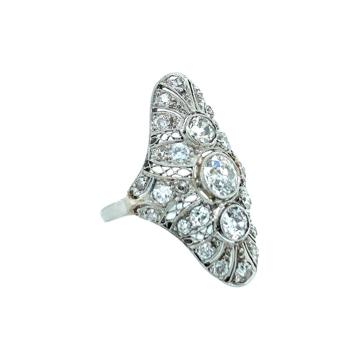 One Art Deco diamond filigree platinum ring centering one bezel set, old European cut diamond weighing 0.80 ct. and surrounded by 28 old European cut diamonds totaling 2 ct. with an average color of J-K-L and SI-2 clarity.

Unmatched, intricate,