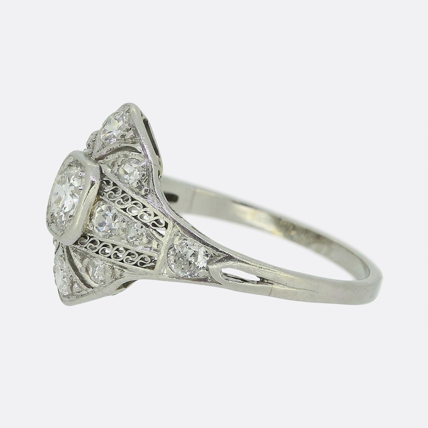 Here we have a fabulous diamond ring crafted at a time when the Art Deco style was at the height of world design. This piece features a single claw set old European cut diamond at the centre of the face in a clean octagonally shaped bordering. This