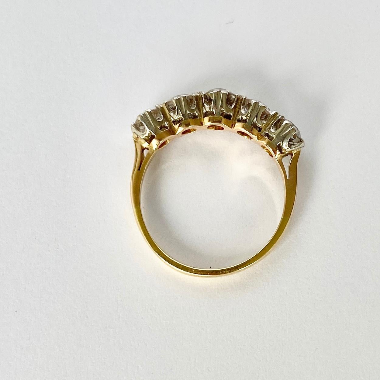 Five glistening diamonds sit fabulously on top of a simple open work setting modelled in 18ct gold. The diamonds total 1ct and are highly included. The diamonds are still bright and have fabulous sparkle. 

Ring Size: J 1/2 or 5 
Width: 5.5mm
Height