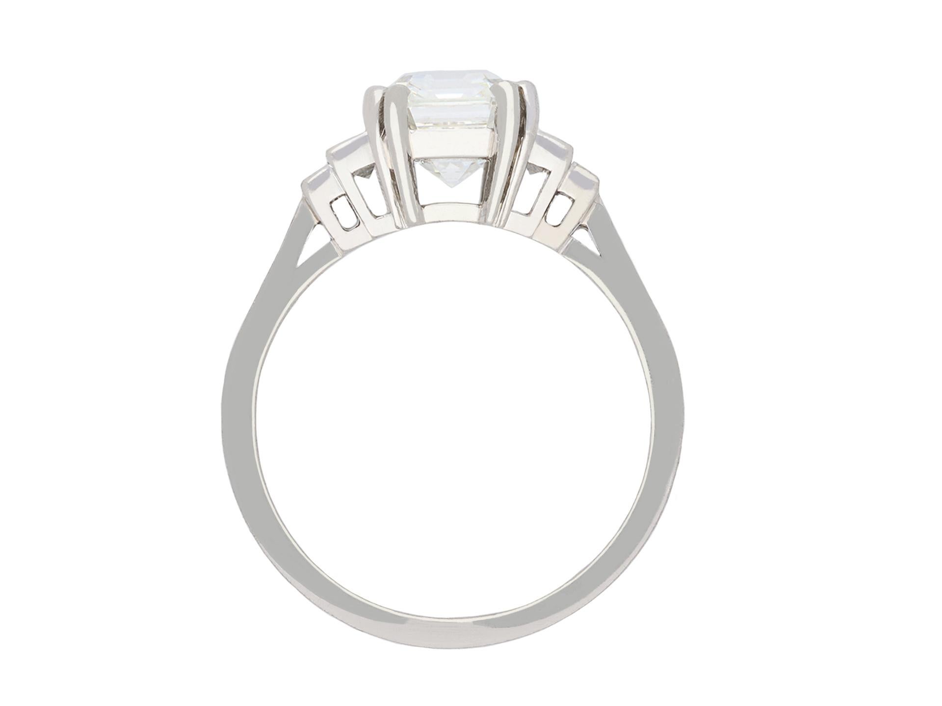 Octagon Cut Art Deco diamond flanked solitaire ring, circa 1930. For Sale