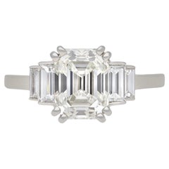 Vintage Art Deco diamond flanked solitaire ring, circa 1930.