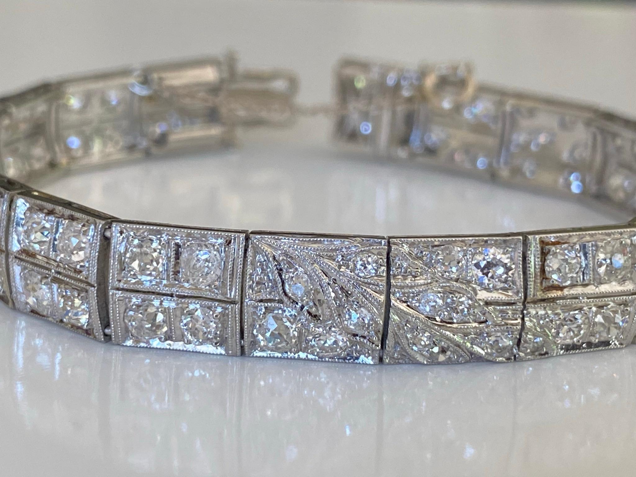 Crafted in the 1930's from platinum, this classic Art Deco link bracelet features one hundred seven natural Old European cut diamonds totaling approximately 6.00 carats, GH color, VS-SI clarity designed with a delicate floral motif. 
