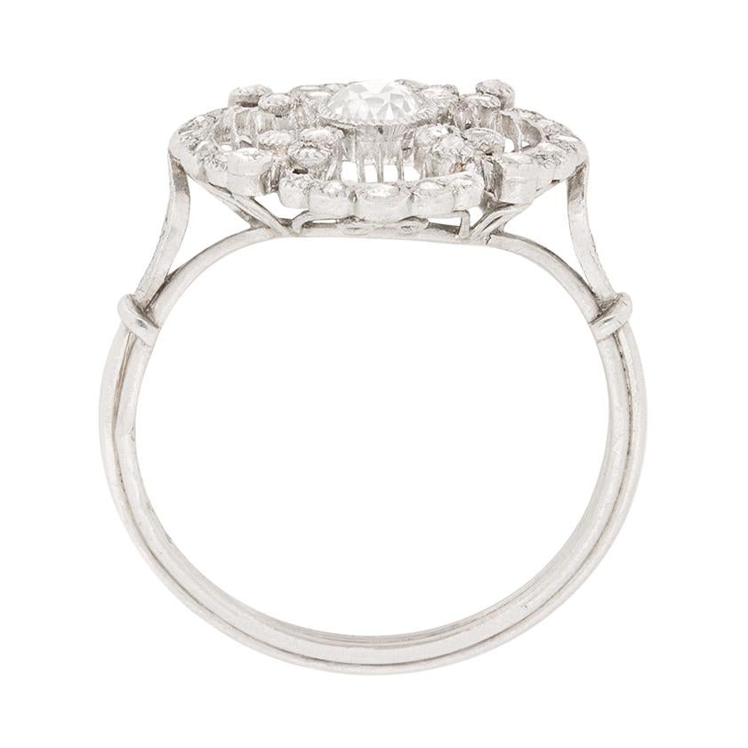 The great art deco ring, which is classically french is style, is ideal as a dress ring, or a unique engagement ring. The centre stone is an old cut diamond, which would have been cut by hand and expertly set within the rub over setting. The diamond
