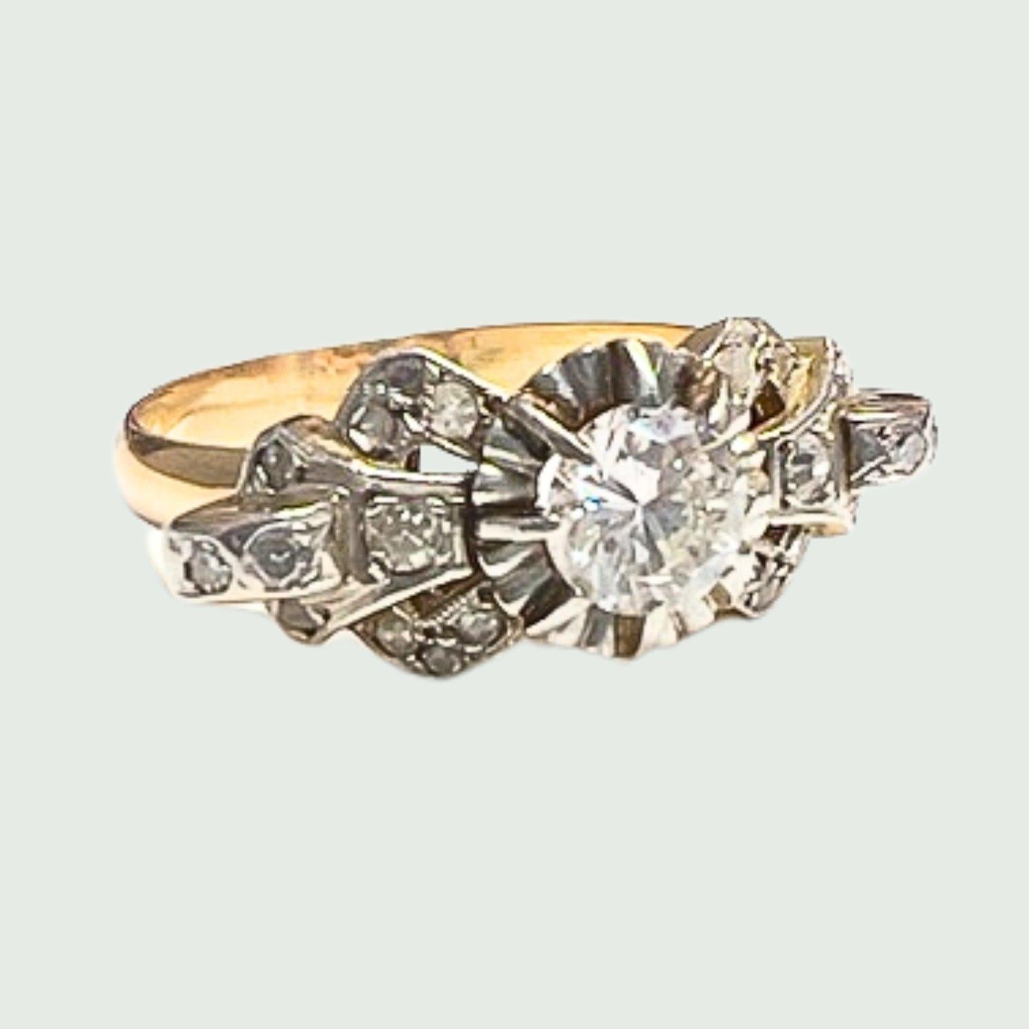 This Art Deco-style ring is crafted in yellow gold 18K with platinum accents, featuring a central brilliant-cut Diamond and rose-cut Diamonds. 
It has a weight of 4.55 grams and is sized 20/60. The central Diamond is 0.70 carats, and the additional