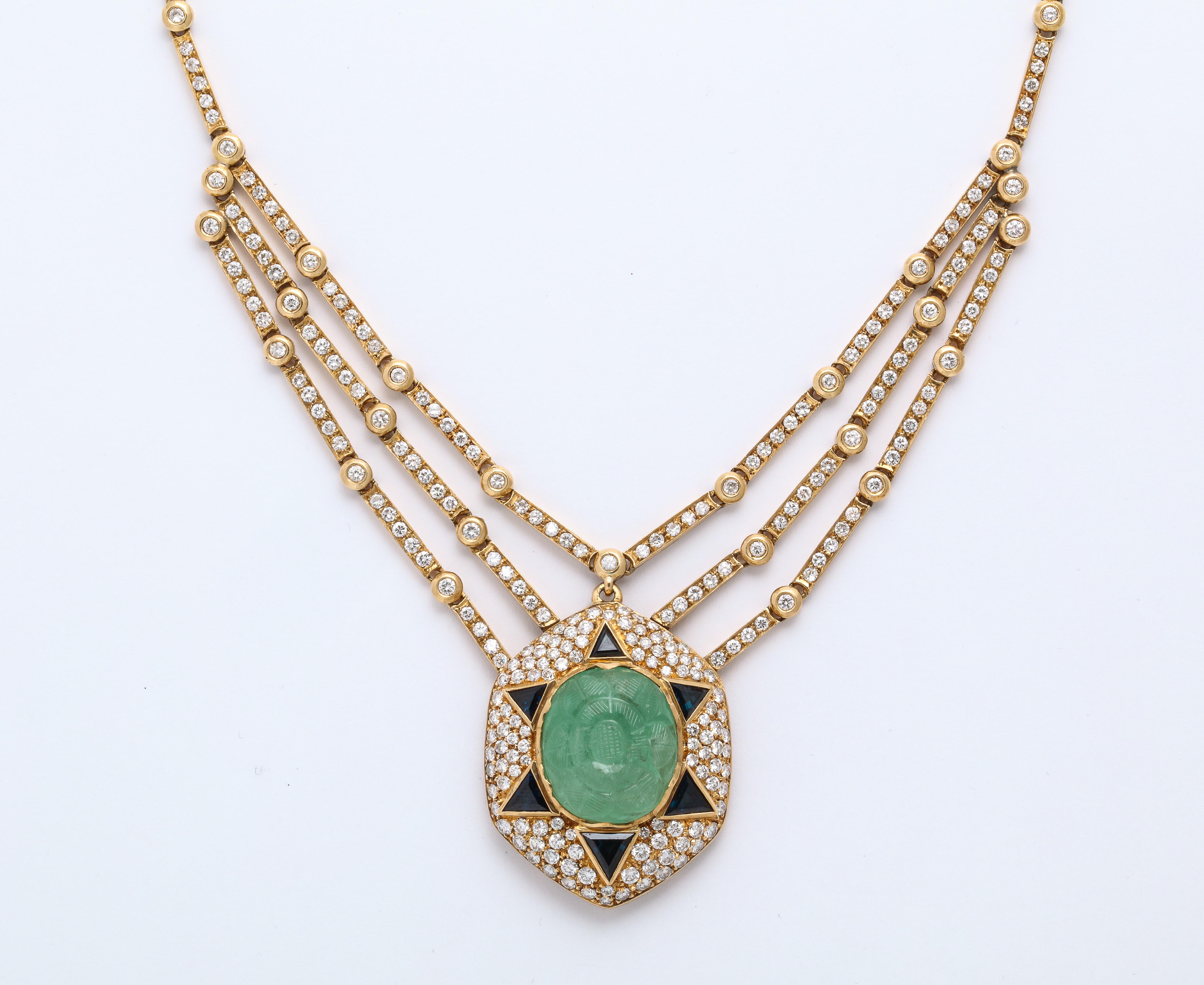 Gorgeous Art Deco style Esclavage Collier Necklace with diamonds, Carved Emerald and triangular cut sapphire center stones set in gold

Necklace is stamped 750 
Total of 374 Diamonds weighing approx. 6.5cts
6 Triangle Cut Sapphires approx. 2.5cts
1