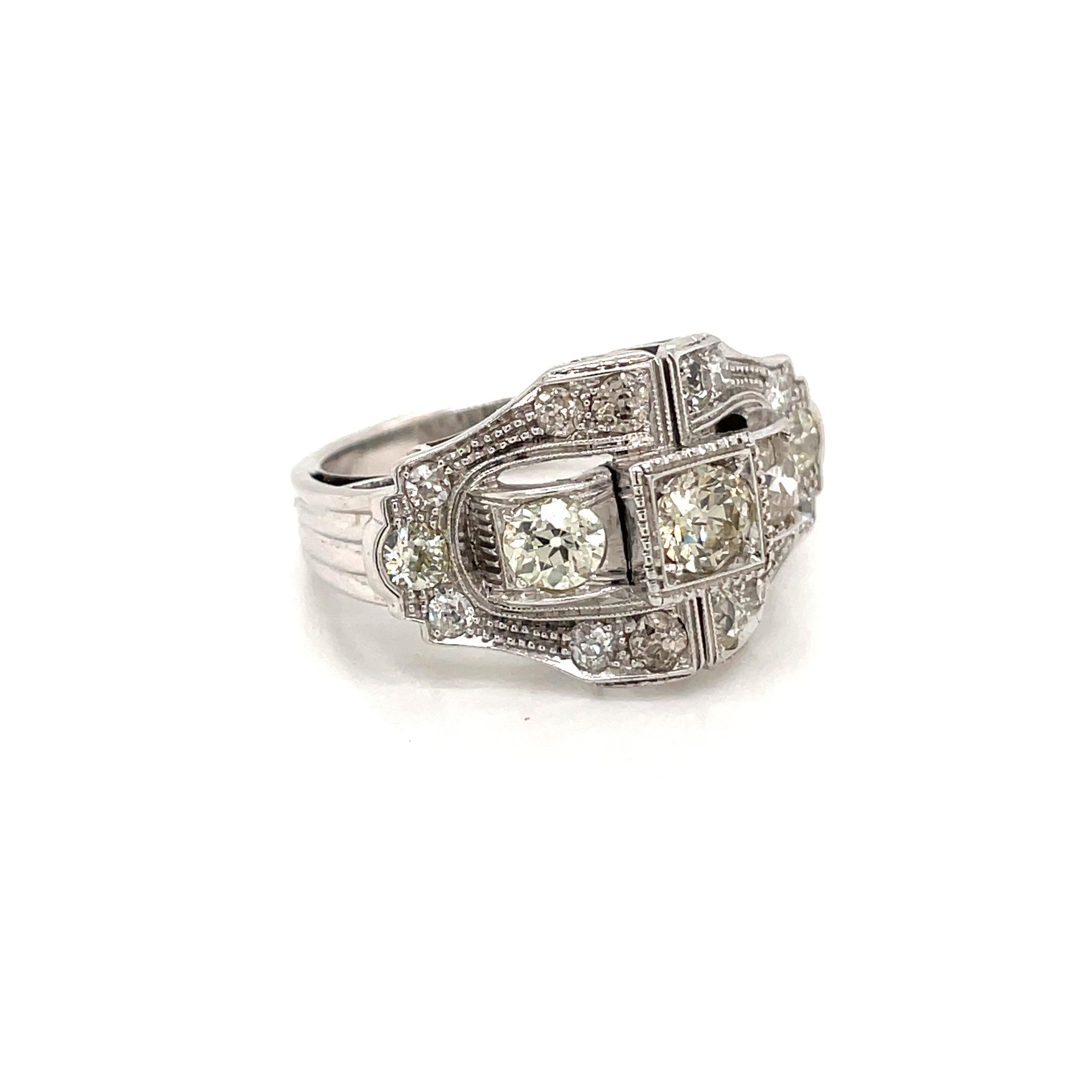 Authentic and rare Art Deco engagement ring set with old mine cut diamonds totaling approximately 2.50 carats, L color and VS clarity.
Entirely hand crafted in 18k gold, this beautiful ring dates to the 1930's.

CONDITION: Pre-owned -