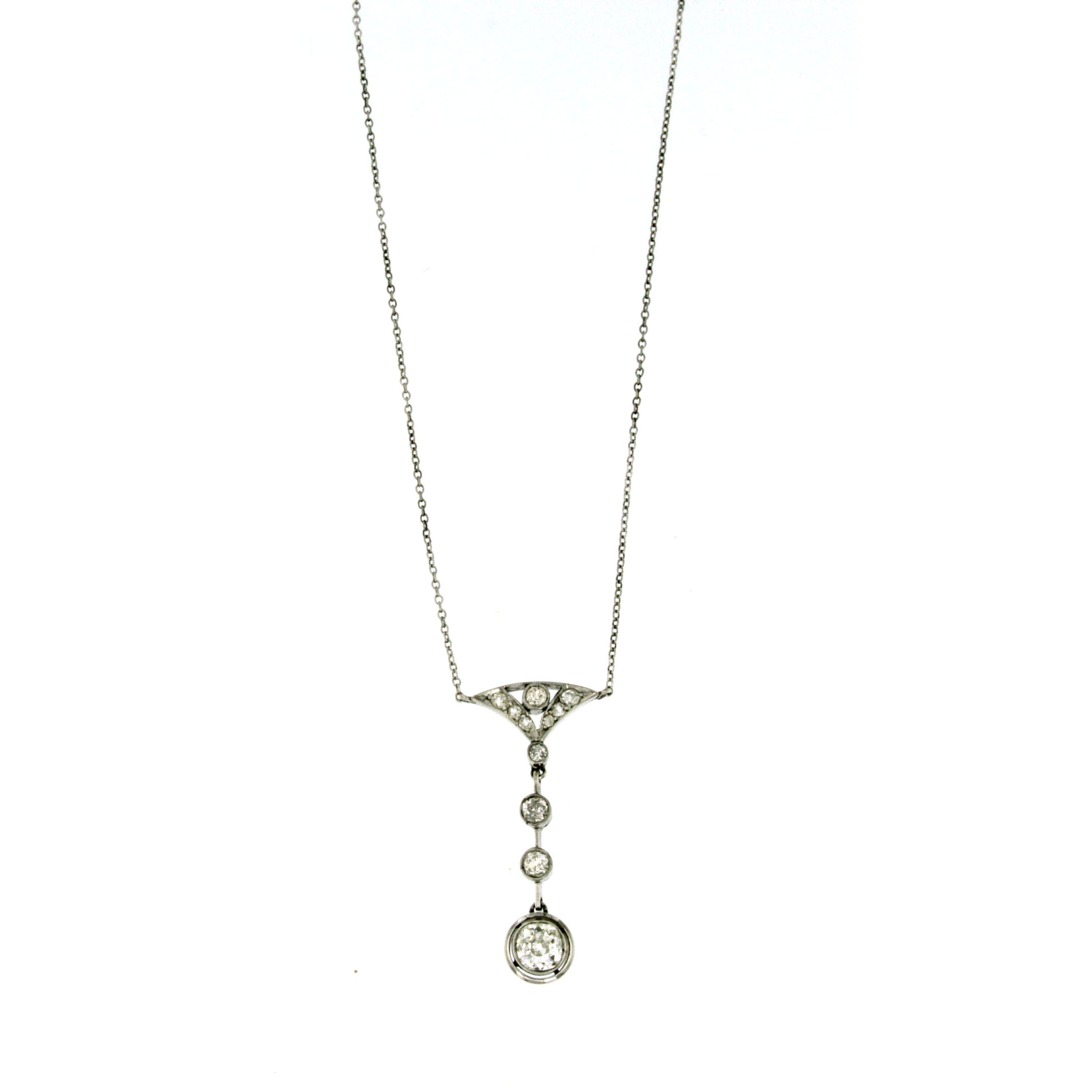 An impressive antique 1930's Art Deco 18k white gold necklace set with old mine cut  diamonds for a total weight of 1.30 Ct  H/I color, Vs clarity ; The necklace comes in the original box.

CONDITION: Pre-owned - Excellent 
METAL: 18k Gold
STONE: