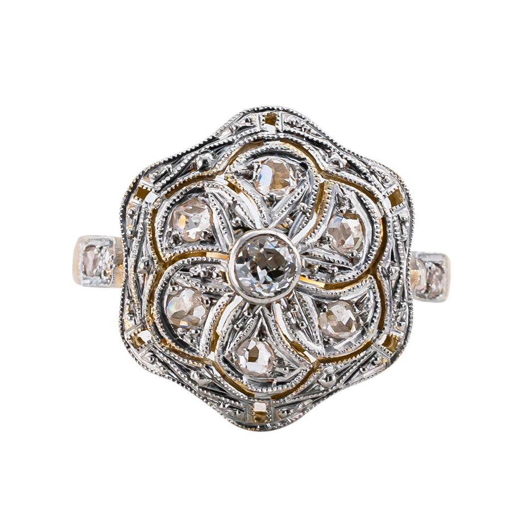 Art Deco diamond gold and platinum ring circa 1930.

DETAILS:

DIAMONDS:  eleven diamonds totaling approximately 0.25 carat, approximately H – I color, SI – I clarity.

METAL:  18-karat yellow gold and platinum.

MEASUREMENTS:  approximately 15 mm