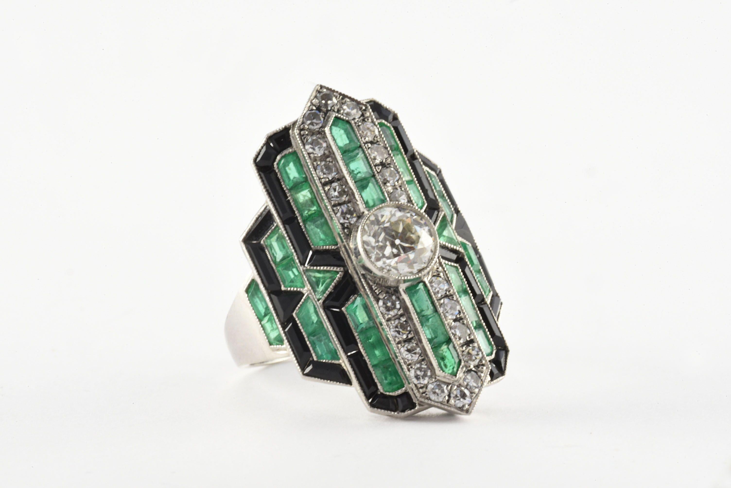 This stunning, geometric Art Deco ring set in platinum is designed around an Old European cut diamond center stone measuring 0.77 carats, F-G color, VS clarity, embellished with twenty-two single cut diamonds totaling 0.50 carats, F-G color, VS-SI