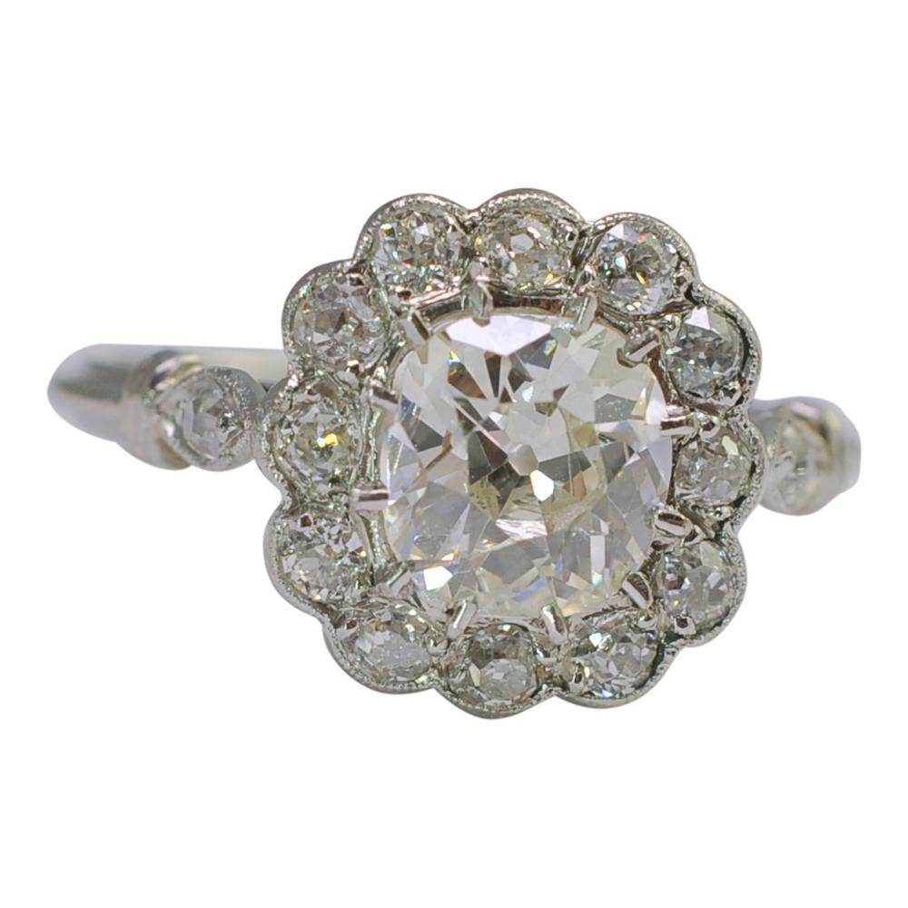 Art Deco Diamond Halo Platinum Engagement Ring For Sale