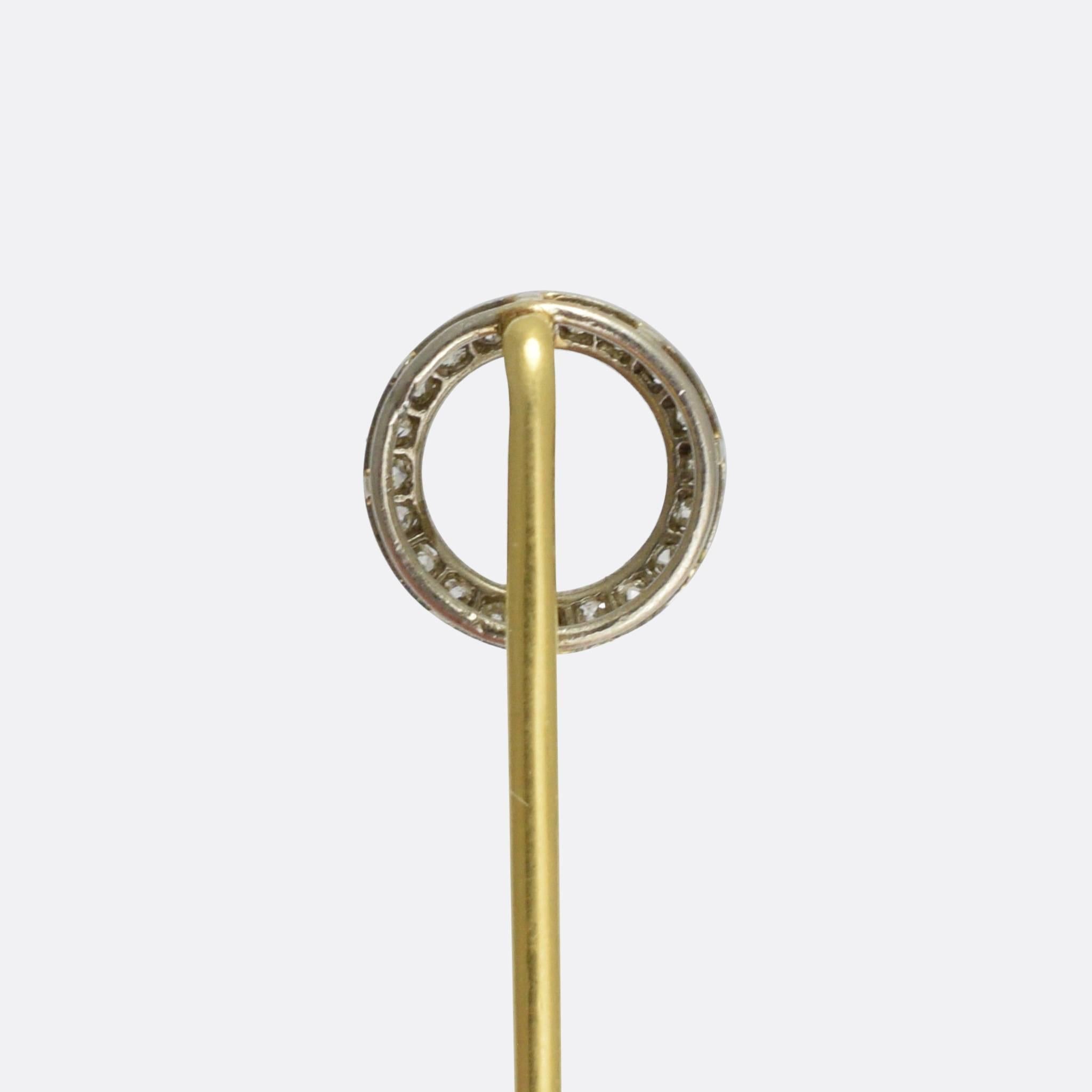 A stylish Art Deco era stick pin, the head modelled as a halo. It's set with rose cut diamonds, and finished in millegrain platinum. 

STONES
Rose cut diamonds

MEASUREMENTS
Length: 6.9cm
Head: 9.7mm

WEIGHT
1.6g

MARKS
No marks present, tests as