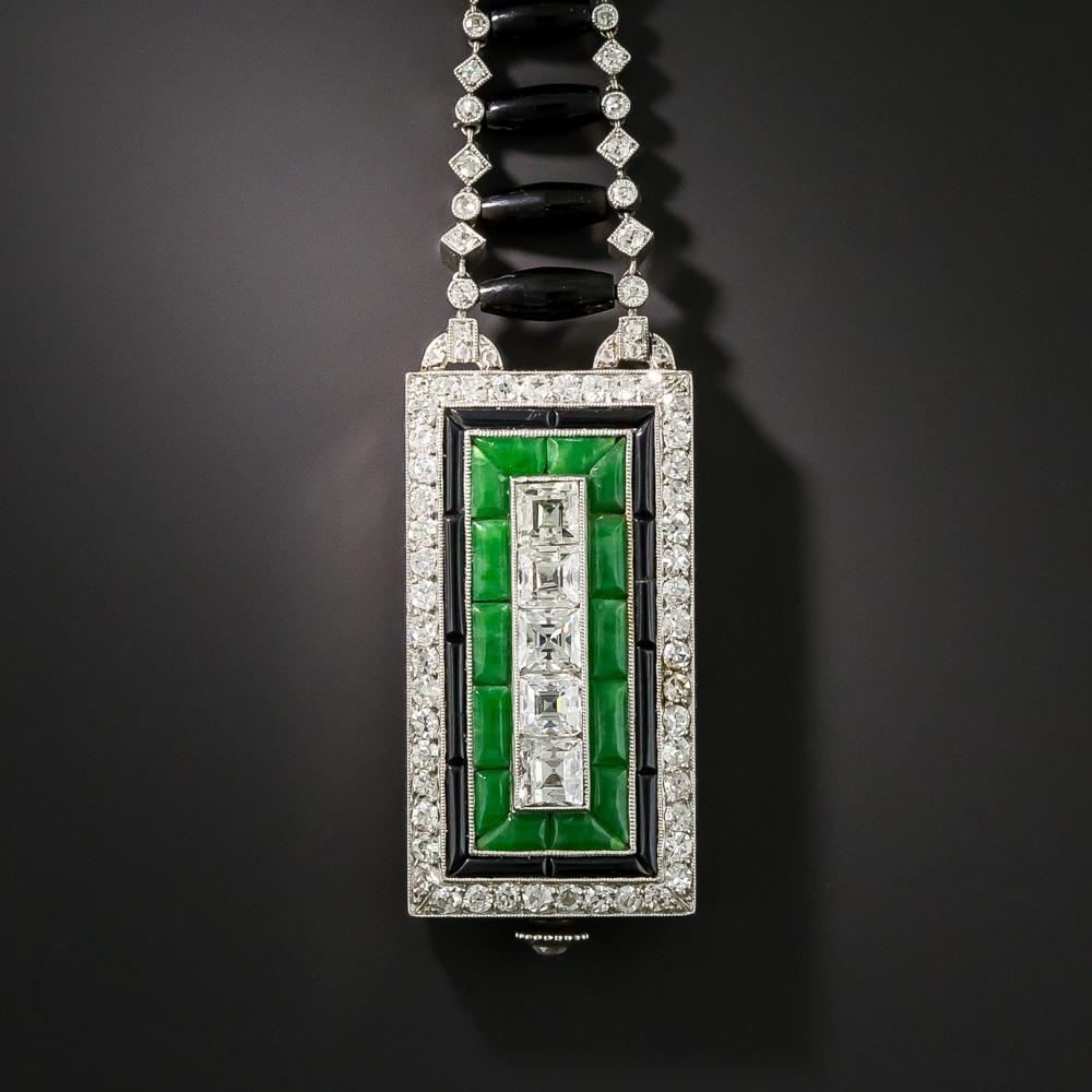 High Art Deco at its finest and most strikingly dramatic - this spectacular work of wearable art will rival any jewel of its kind by the most renowned French jewelers of the Jazz Age. Measuring 3 1/4 inches long, The elongated rectangular watch case