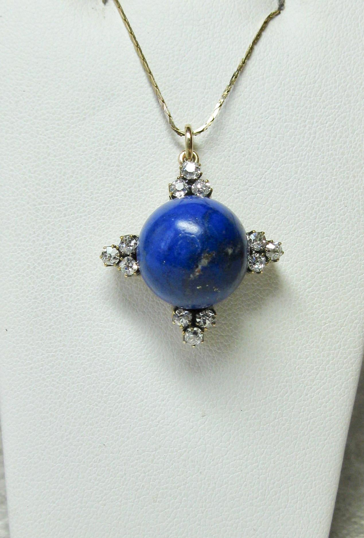 A stunning Antique Art Deco - Victorian Pendant with a gorgeous central 16 Carat Lapis Lazuli sphere set with 12 absolutely radiant Old Mine Cut Diamonds totaling approximately 1.2 Carat.  The sparkling white antique diamonds are G-H color - very