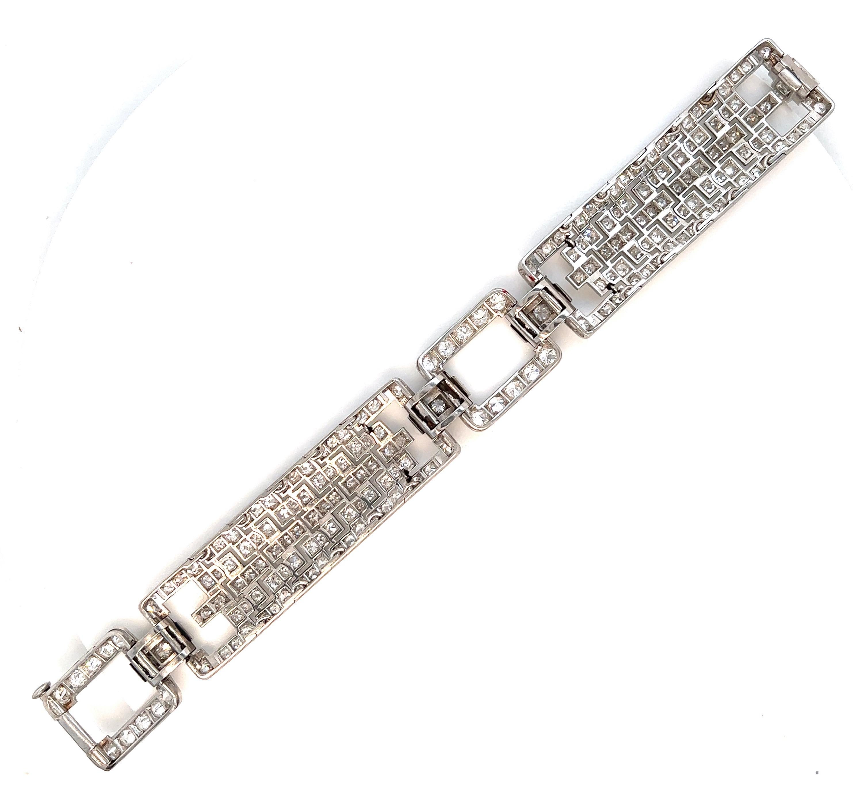 Art deco bracelet made out of platinum and set with brilliant, single-cut, and square diamonds weighing approximately 12 carats. Total weight: 41.1 grams. Width: 0.69 inch. Length: 6.75 inches. Circa 1935. Comes in original fitted box. 