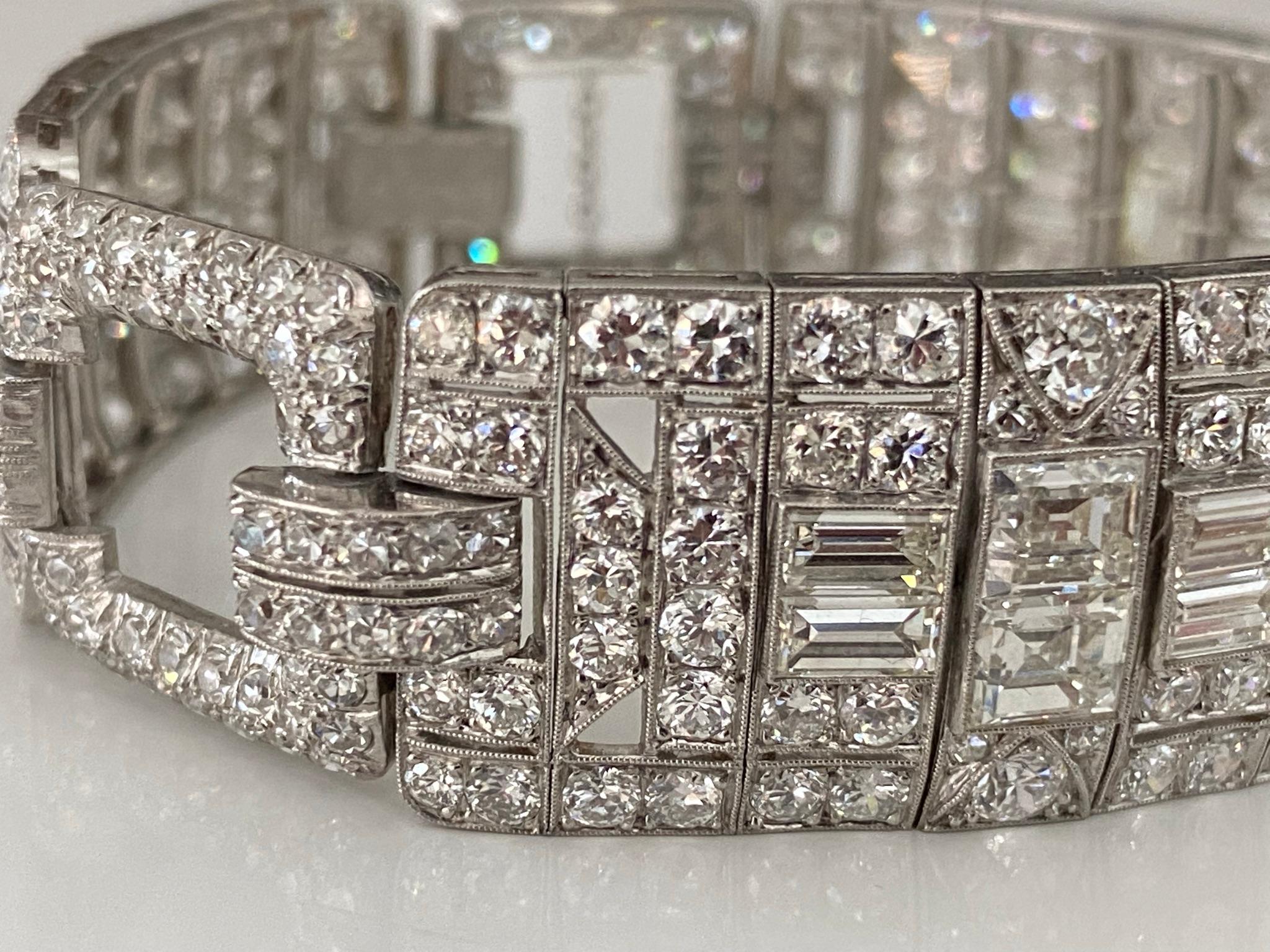 This magnificent Art Deco link bracelet handcrafted in platinum in the 1920s features a repeating geometric design adorned with an array of glistening emerald cut, Old European cut, single cut and baguette diamonds totaling approximately 20.00