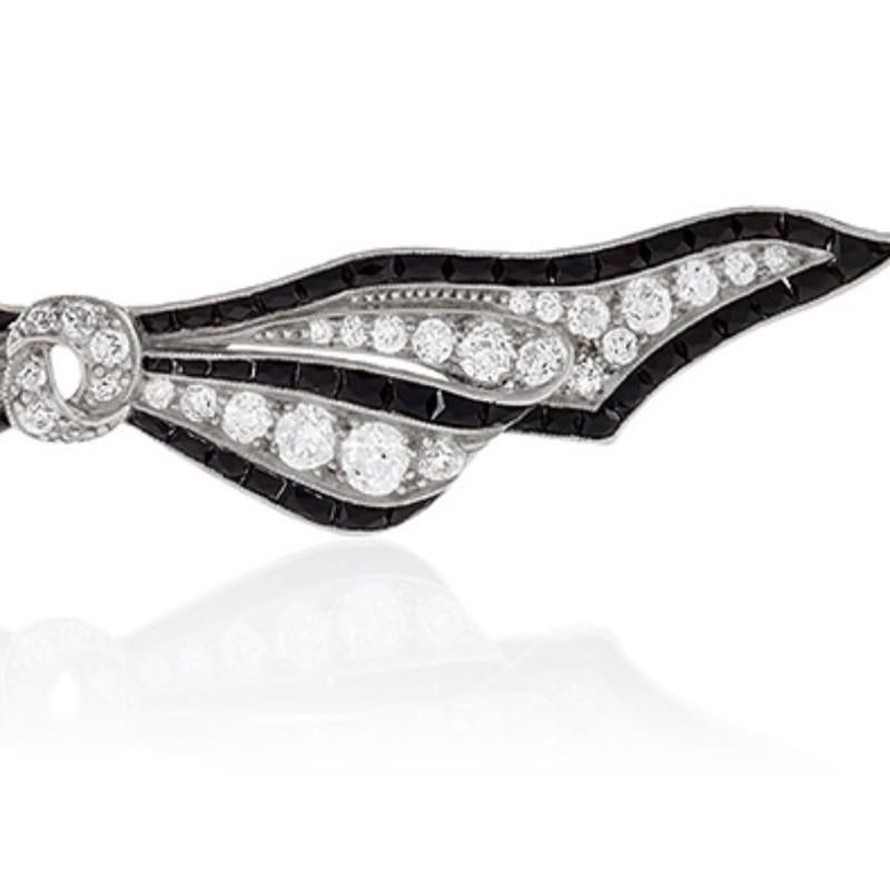 Women's Art Deco Diamond Onyx and Platinum Bow Brooch For Sale