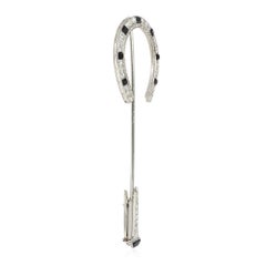 Art Deco Diamond, Onyx, and Platinum Horseshoe Jabot Brooch with Nail Terminal