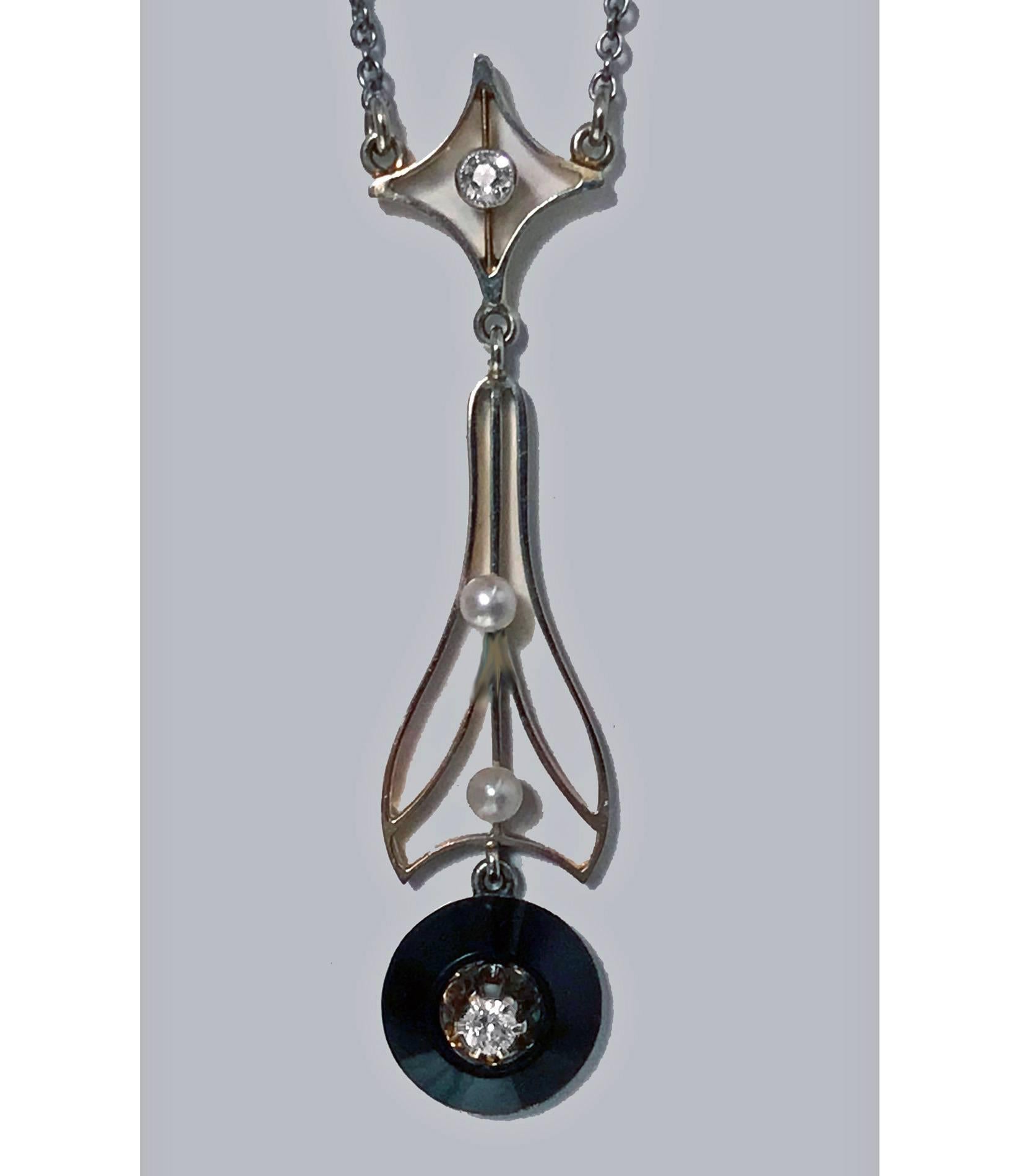 Diamond Onyx Pearl 14K Necklace Pendant, American, C.1930. The Pendant drop of stylised 14K knife edge design, suspending a diamond set cone shape black onyx, surmounted with open foliate gold section set with two small natural silver grey pearls