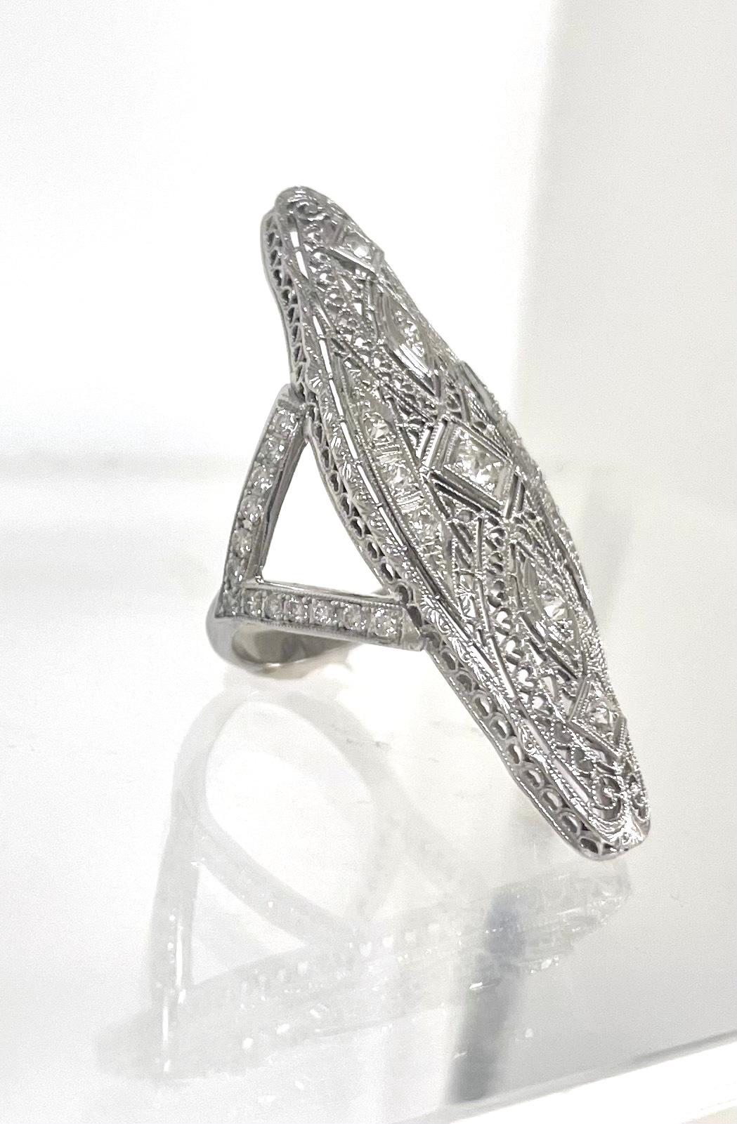 Description
A 1920’s Art Deco piece, born as a brooch and revamped to become this magnificent ring refashioned with a lovely Y-shaped pave diamond band.
Item #R126

Materials and Weight
Diamonds 1.60 carats,  45.5x16 mm marquise shape
14k white gold