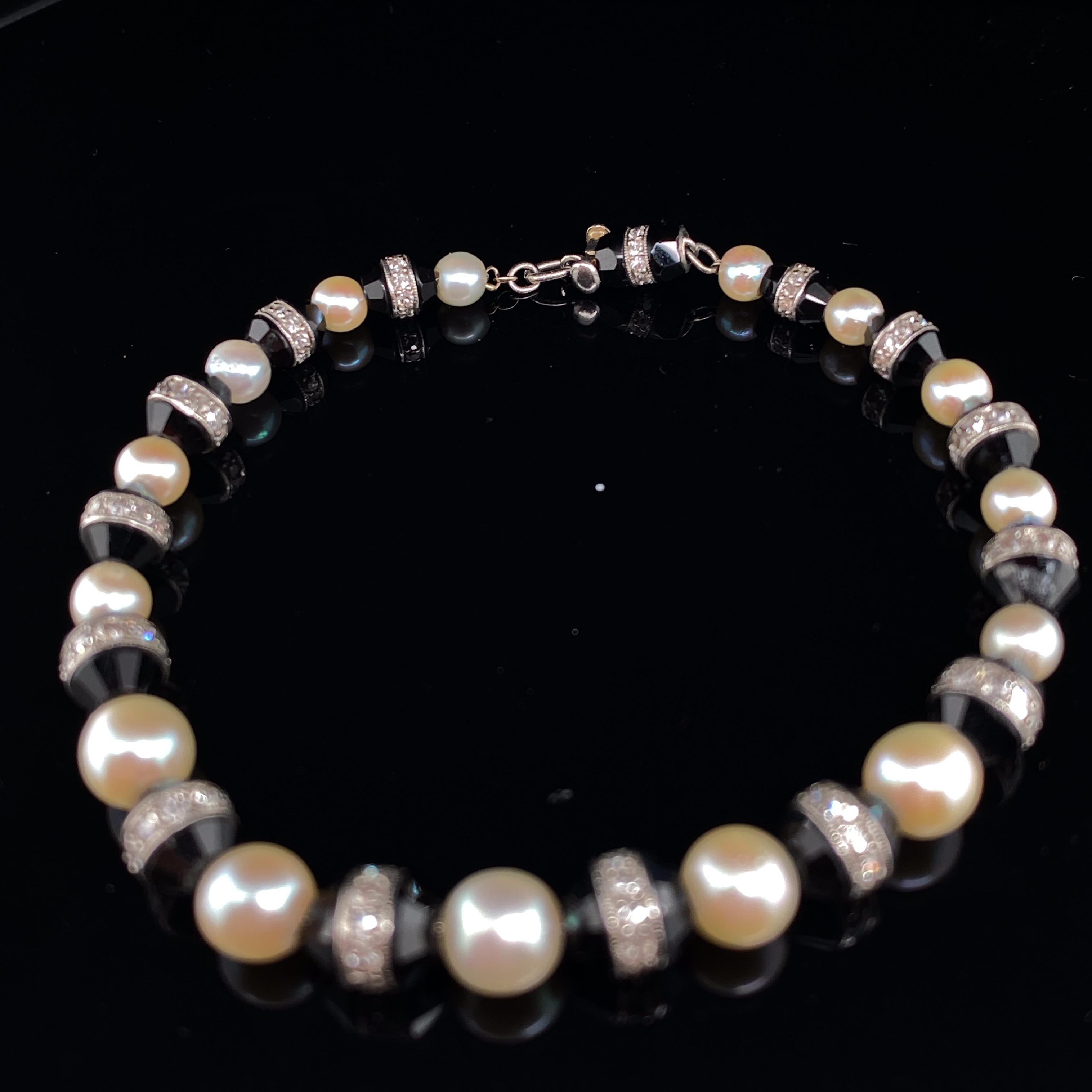Art Deco Diamond, Pearl and Onyx Platinum Bracelet In Good Condition In London, GB