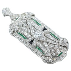 Late Art Deco Diamond Brooch in platinum, emerald, onyx, 2.6cts of diamonds