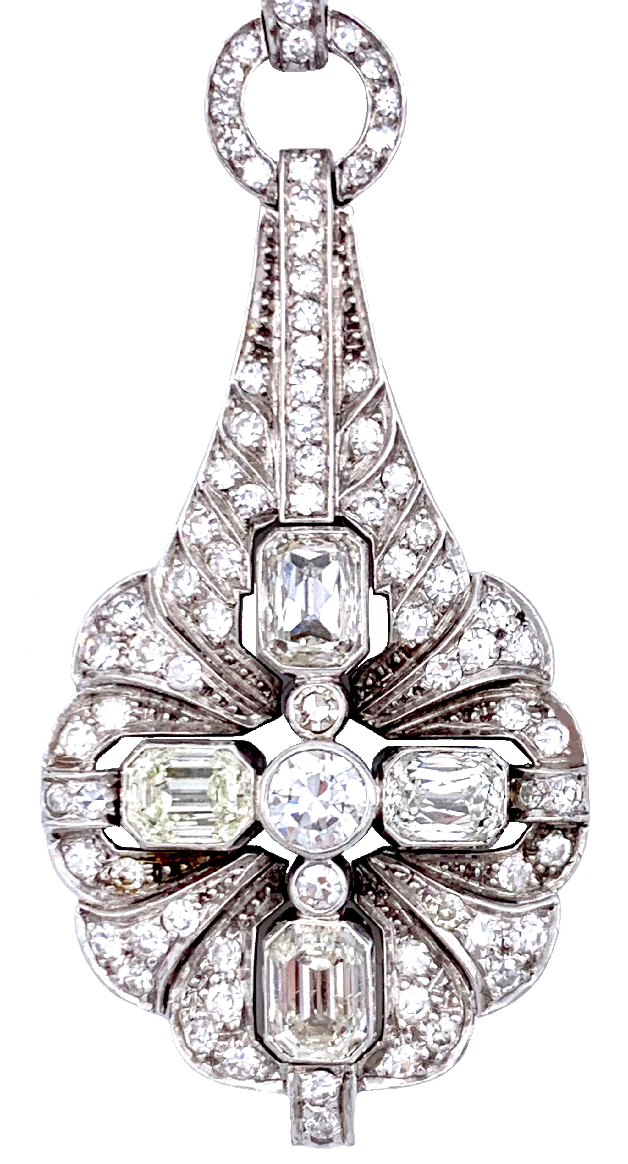 The pendant is composed out of four large emerald cut diamonds with an established weight of 1.83 carats.
 Colour (J-K-L), clarity VS 1-2
There ar 80 diamonds in 8/8 cut with an established weight of 1.18 carats. 
 Colour (I-J),VS 1-2
The pendant is