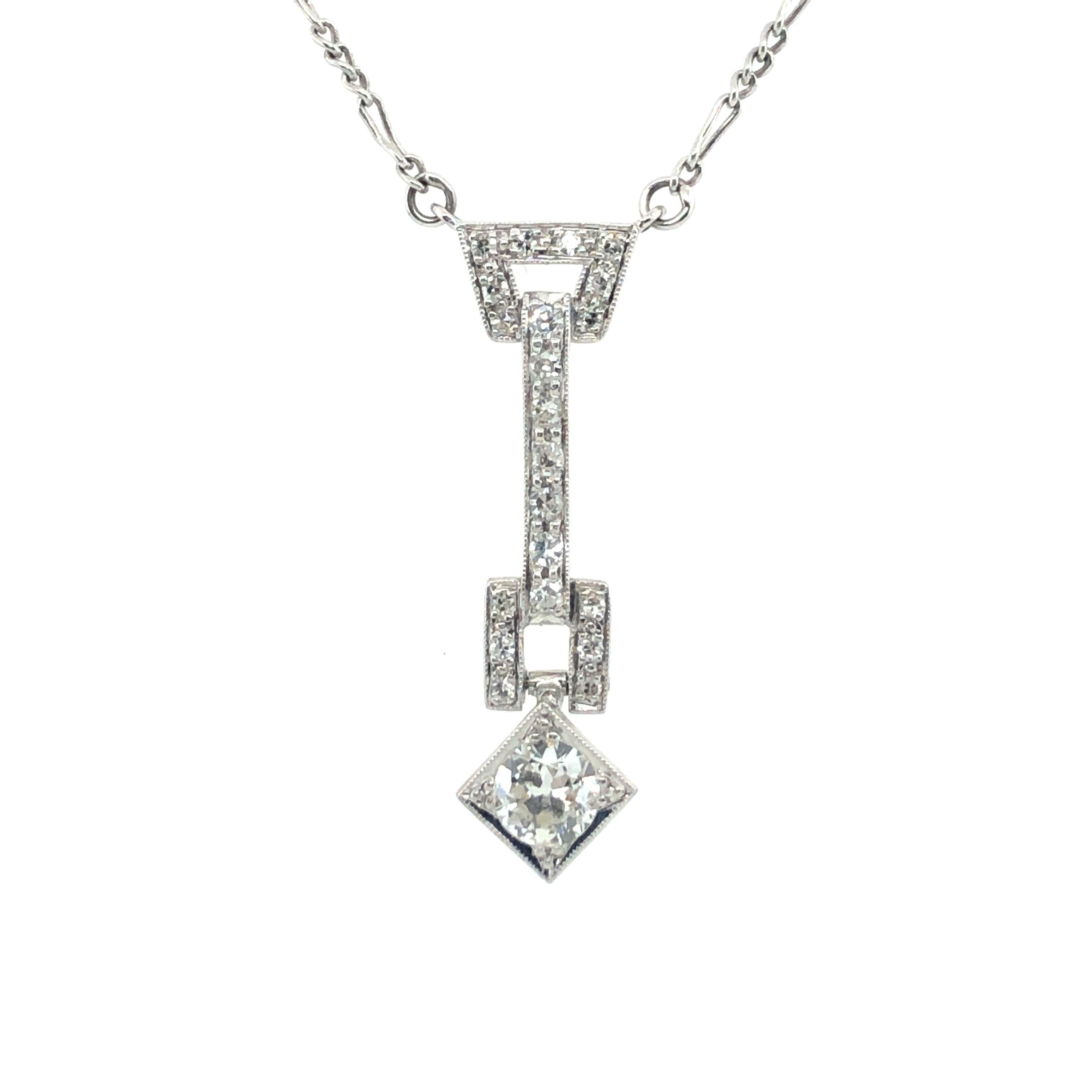 This beautiful geometric art deco necklace is finely crafted in platinum 950 and set with an old European cut diamond of approximately 0.35 carats, H/I colour and si/i clarity.
The elongated, elegant upper part of the pendant is set with 21