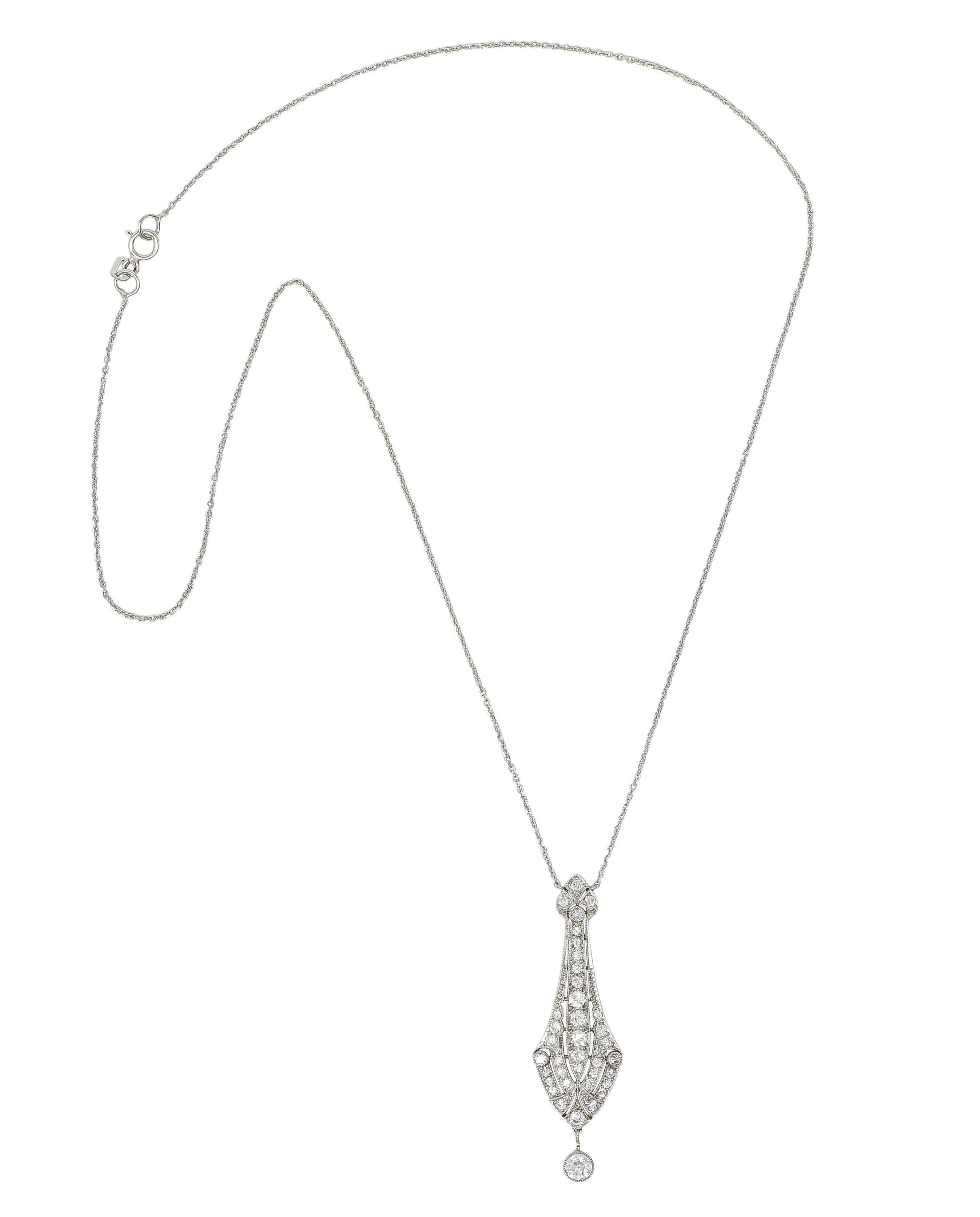 Comprised of 0.5 mm white gold cable link chain suspending an oblong drop pendant 
Pierced with streamlined motifs and bead set with old European cut diamonds 
Weighing approximately 0.62 carat total - G color with VS2 clarity
Suspending an