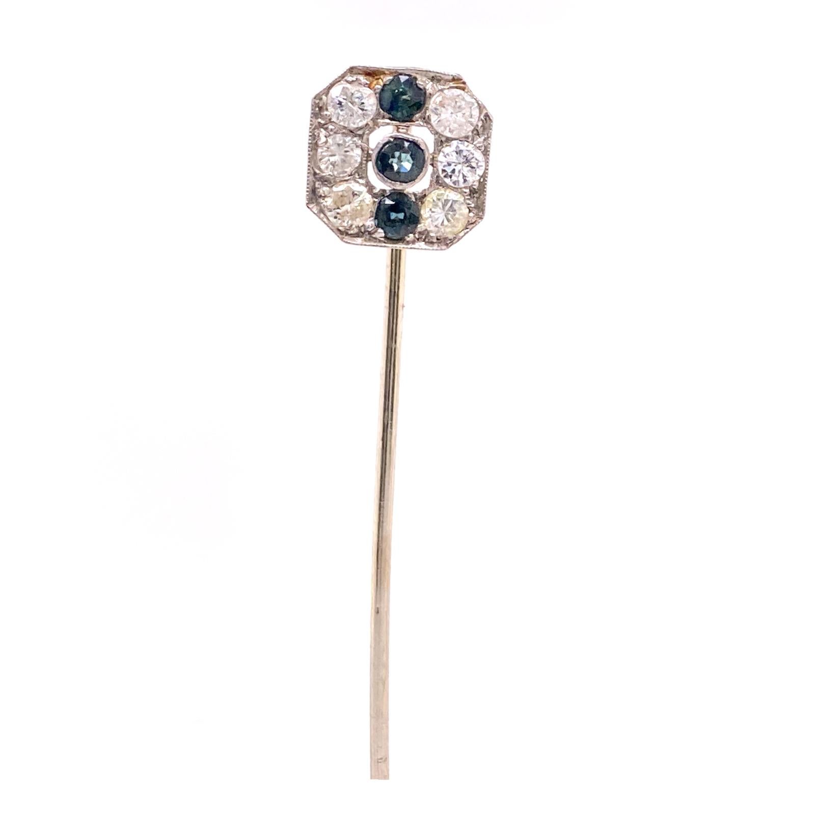 Original Art Deco stick pin handmade in platinum and yellow gold. The 6 Old Mine cut diamonds weigh approximately .70 carat total weight and graded H-I color and SI clarity. I am assuming the sapphires are synthetic hence the time period, but they